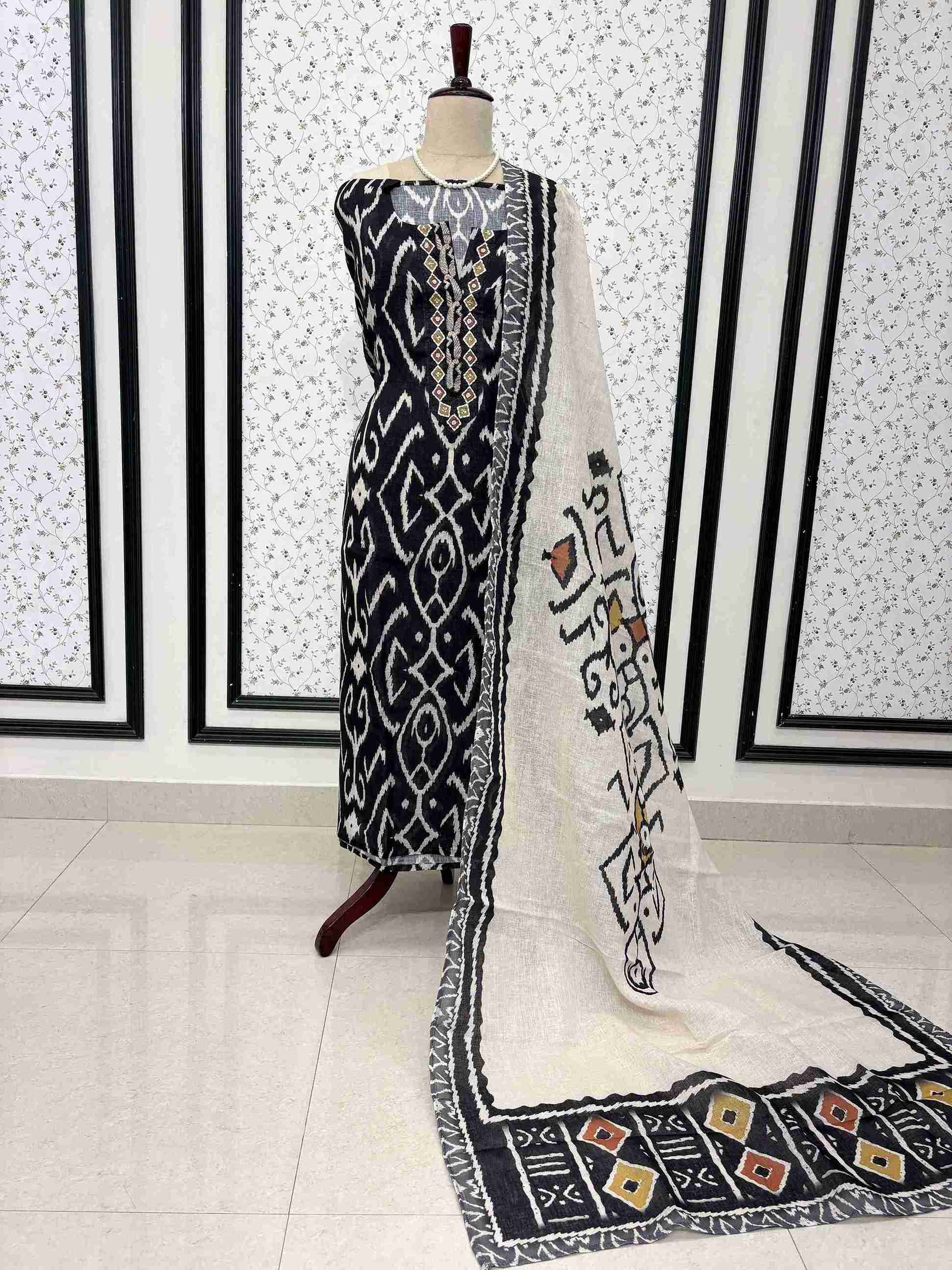 Navy blue linen unstitched suit full front view with off-white multicolor ikat print dupatta draped on mannequin
