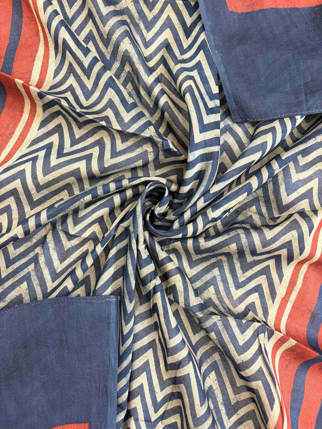 All-over zigzag chevron pattern across navy blue mul cotton dupatta surface