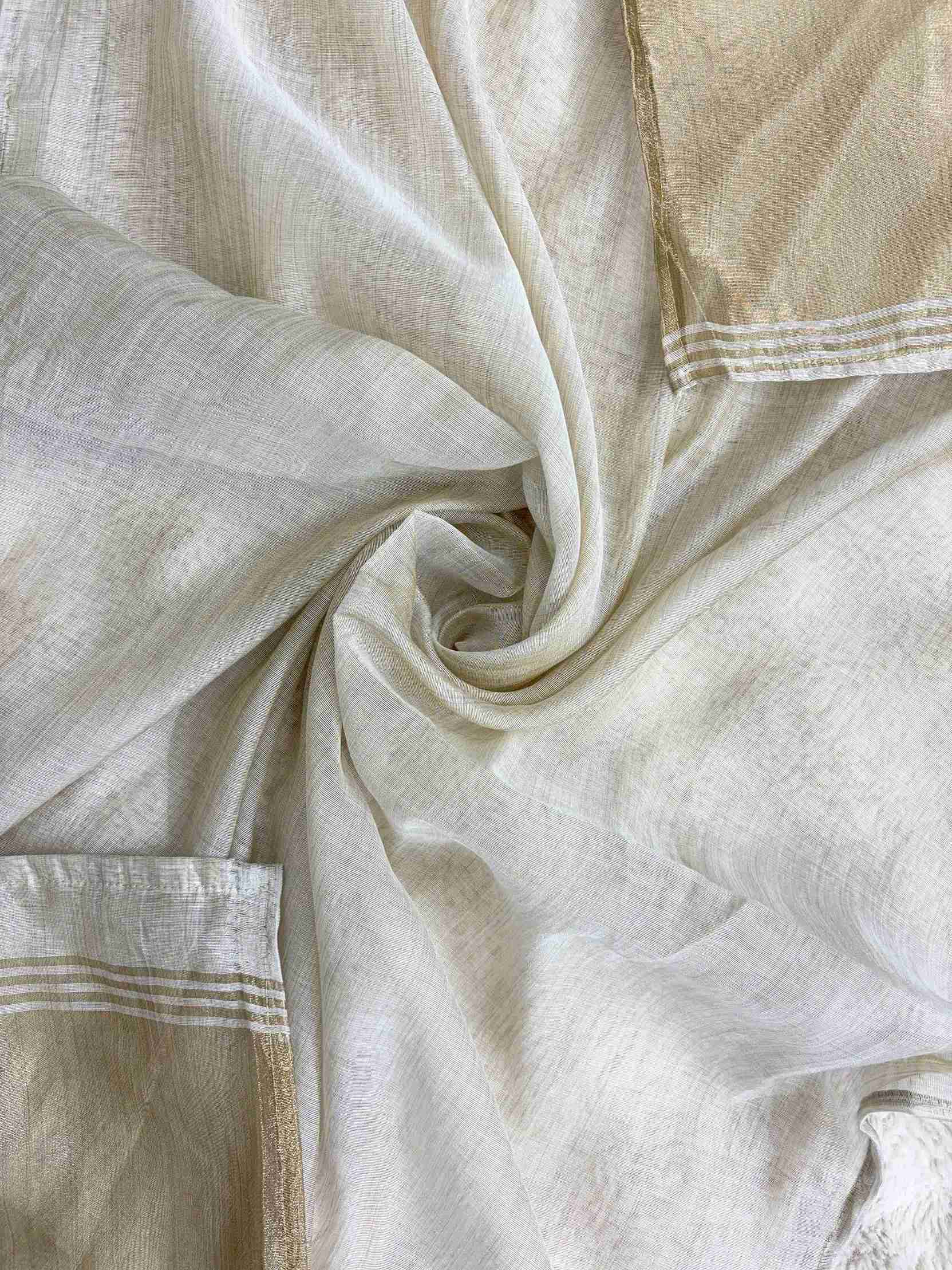 Broad gold zari patta along shorter sides of off-white jamdani cotton dupatta