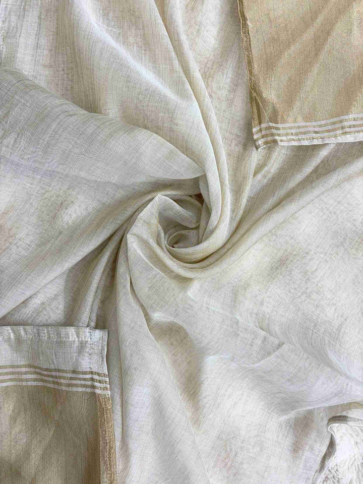 Broad gold zari patta along shorter sides of off-white jamdani cotton dupatta