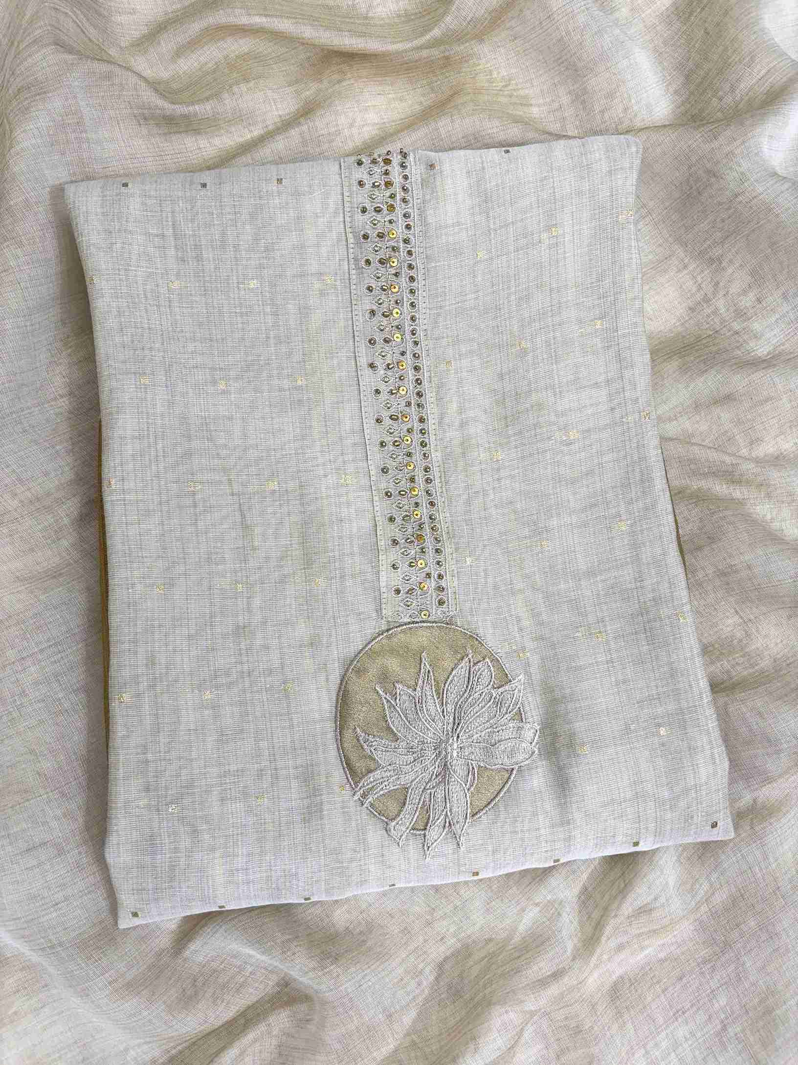 Minimalist neckline with applique floral highlighting on off-white jamdani cotton shirt