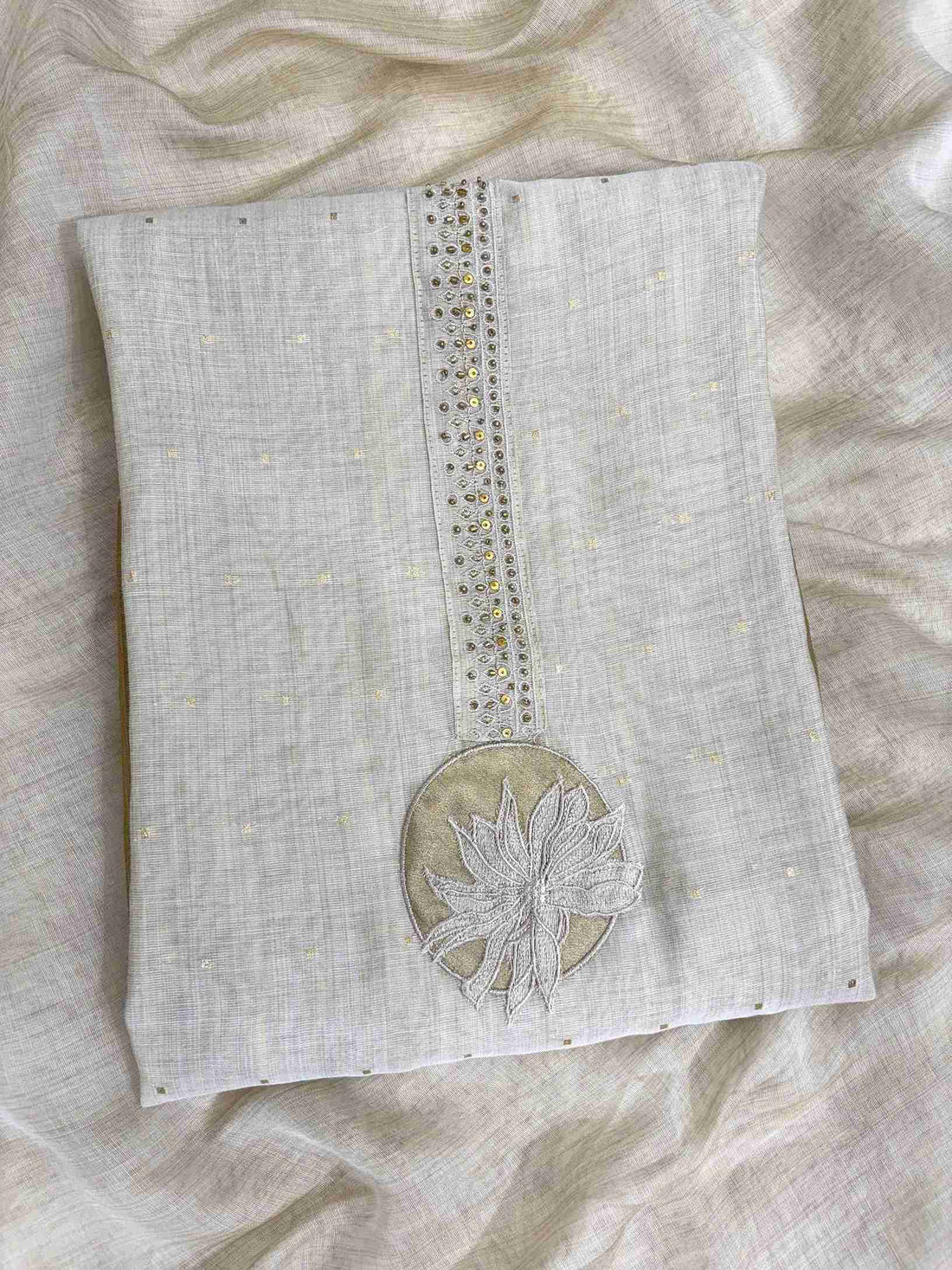 Minimalist neckline with applique floral highlighting on off-white jamdani cotton shirt