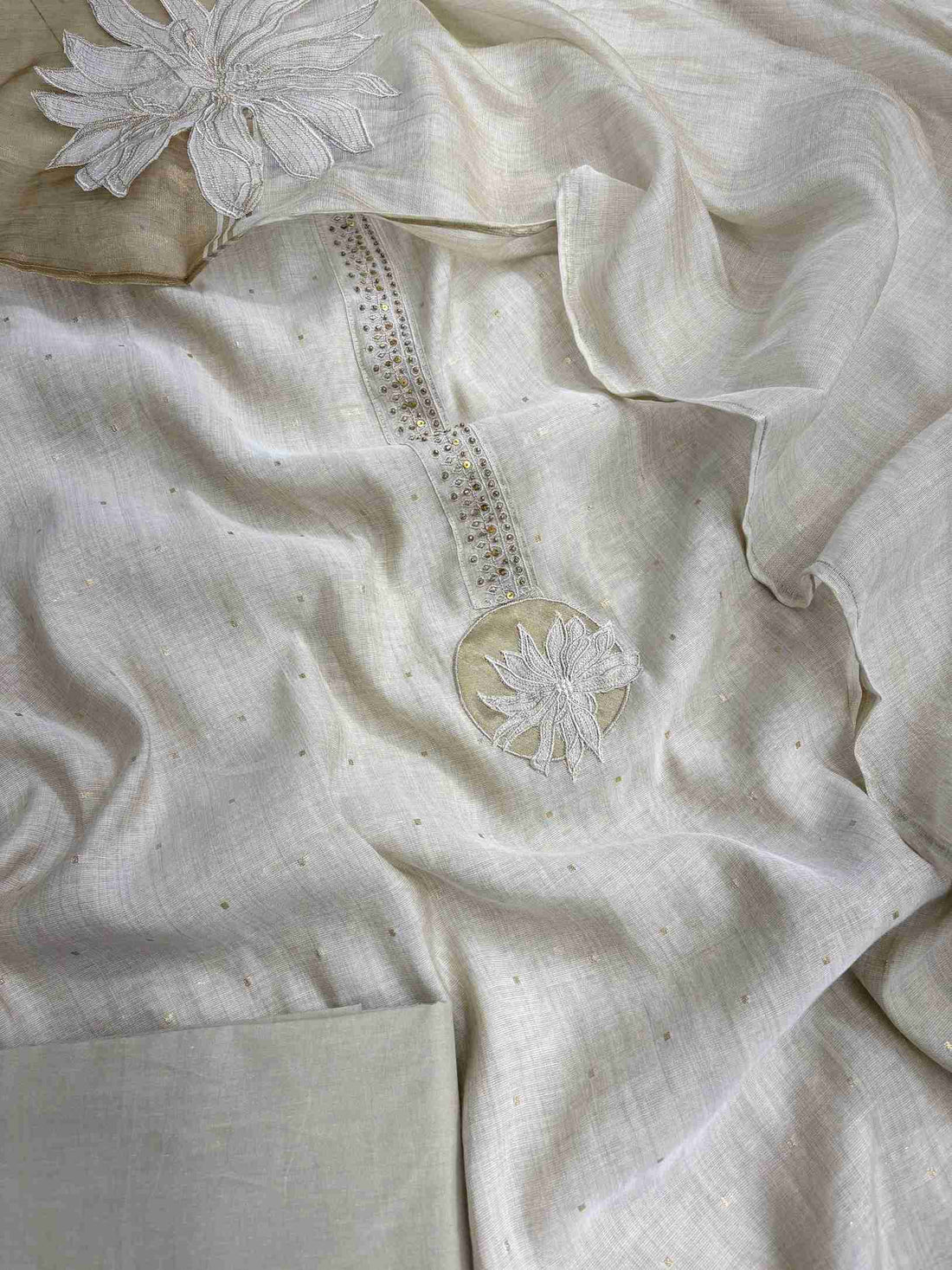 Complete off-white jamdani cotton unstitched suit flat lay set with shirt, dupatta, and plain cotton bottom
