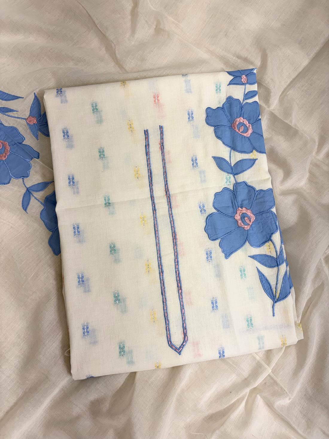 All-over multicolor woven floral booties in pink, blue, yellow, and blue across off-white pure cotton shirt body