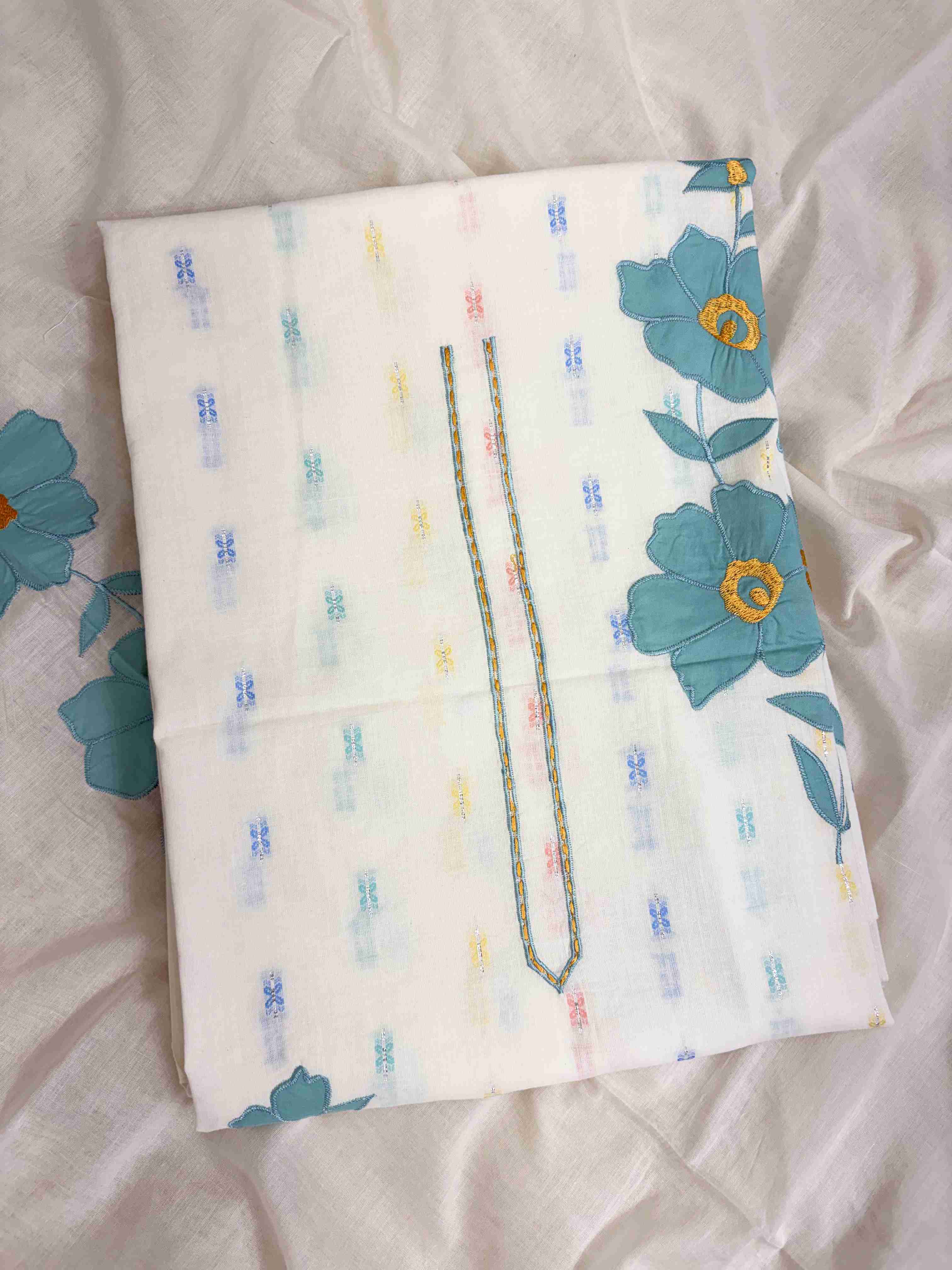 All-over multicolor woven floral booties in pink, blue, yellow, and teal across off-white pure cotton shirt body