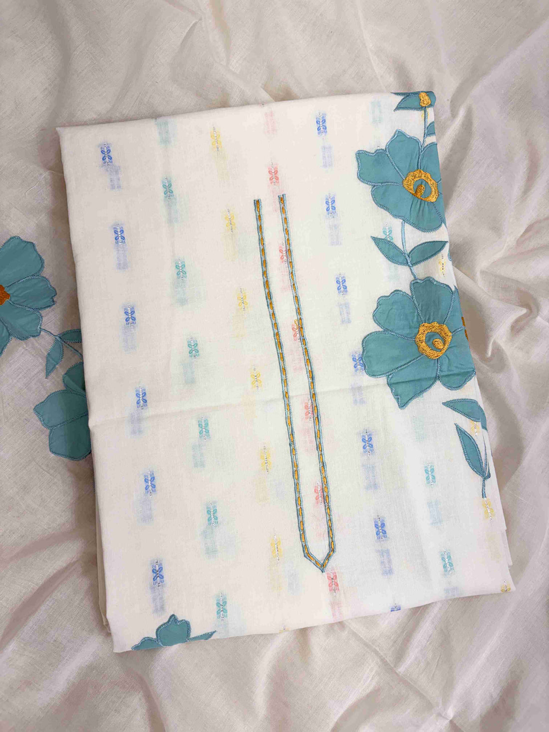 All-over multicolor woven floral booties in pink, blue, yellow, and teal across off-white pure cotton shirt body