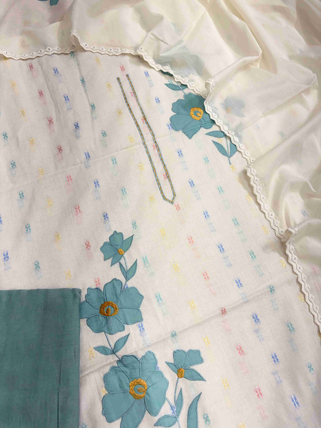 Teal blue applique floral patches and scalloped crotia lace border on off-white pure cotton dupatta
