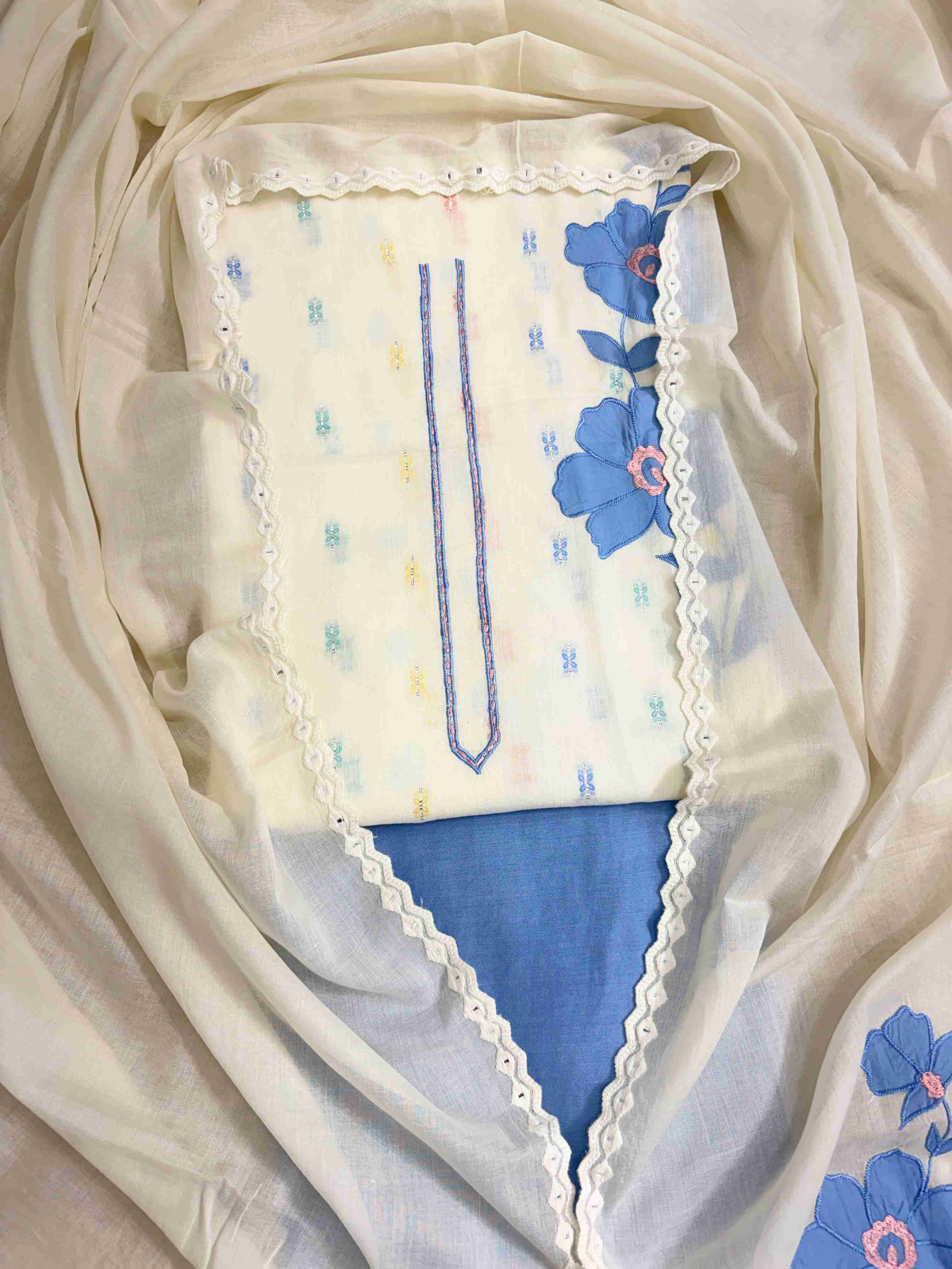 Complete off-white pure cotton unstitched suit flat lay set with shirt, dupatta, and blue cotton bottom