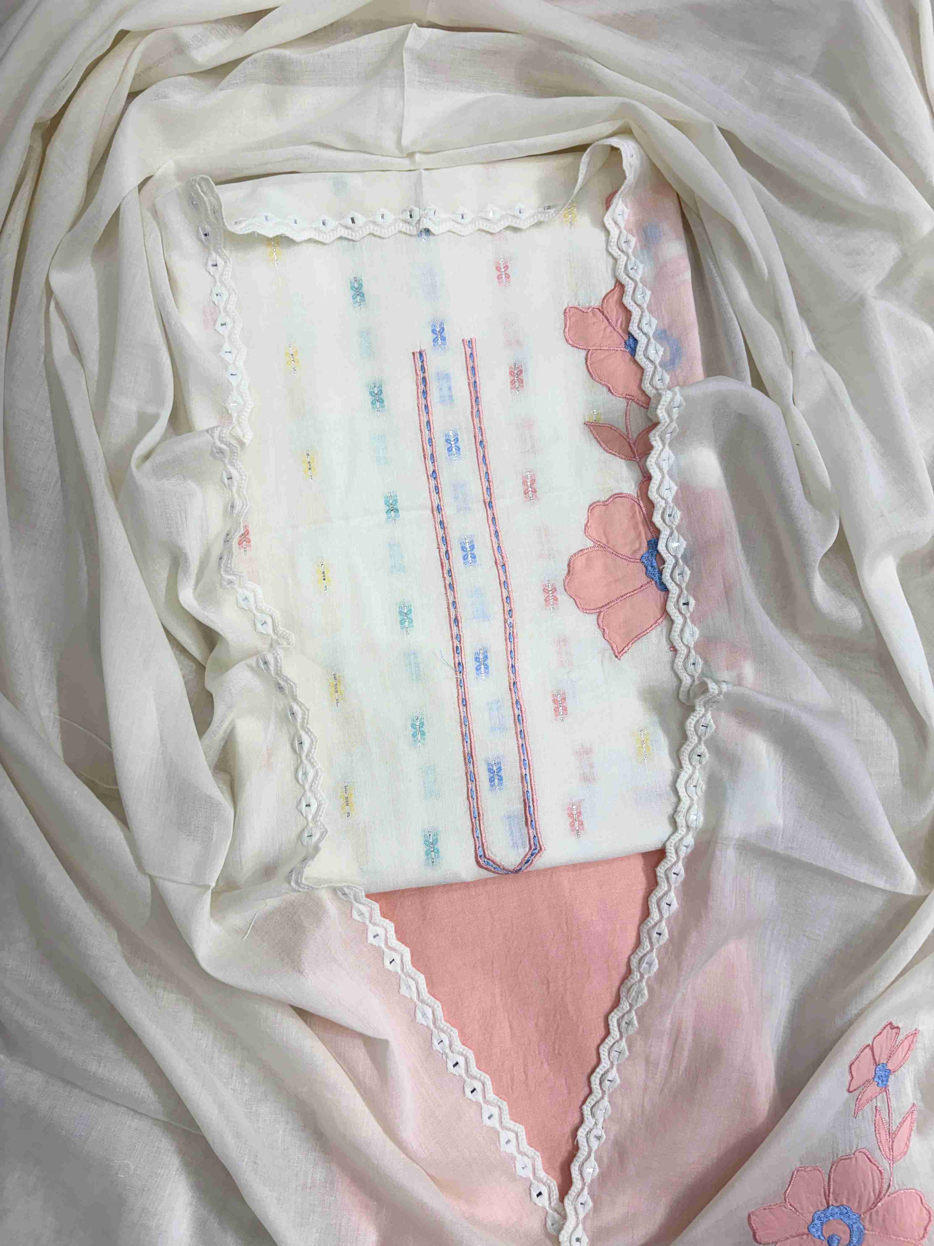 Complete off-white pure cotton unstitched suit flat lay set with shirt, dupatta, and pink cotton bottom