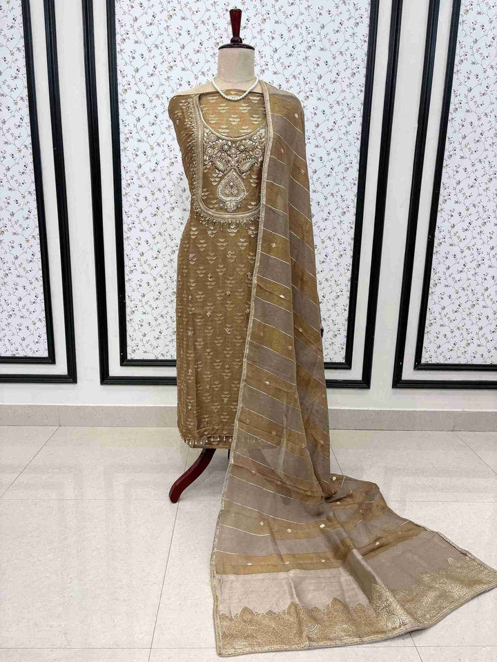 Broad Banarasi border detailing on olive brown shimmer tissue dupatta