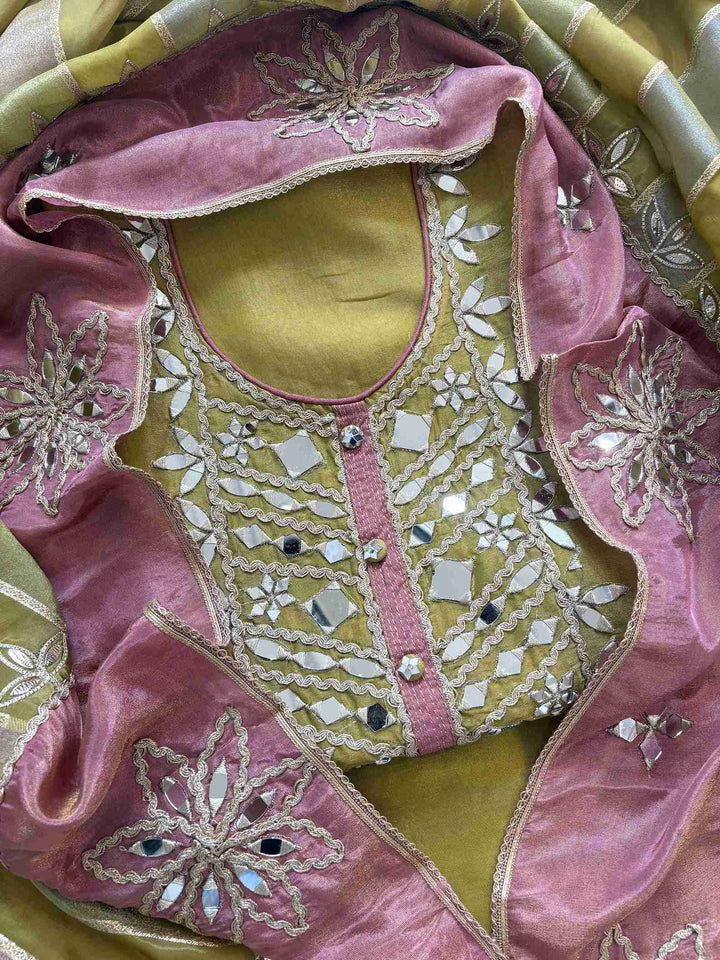 Olive green shimmer tissue unstitched suit with heavy mirror work neckline