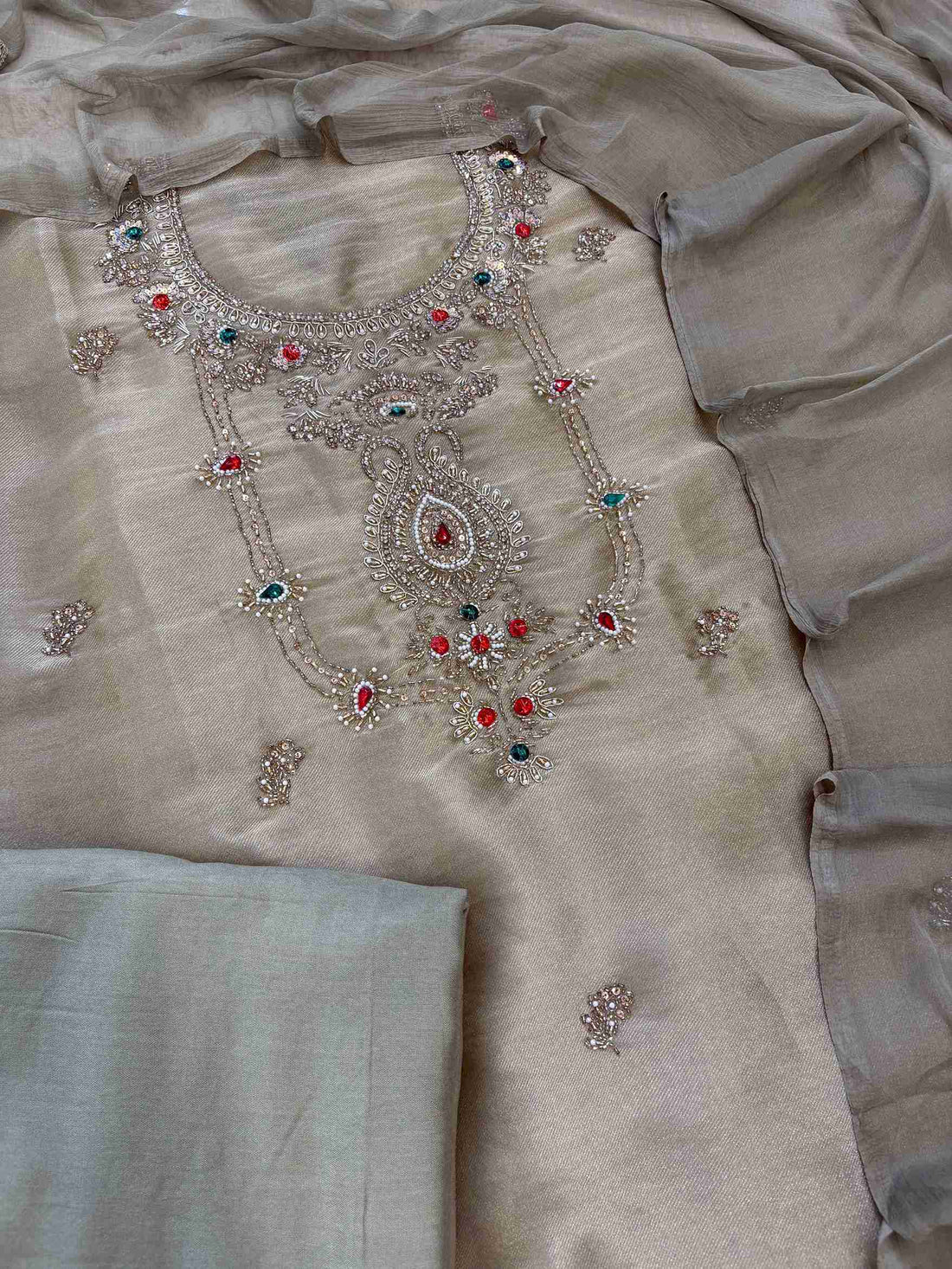 Close-up of zardozi embellished neckline with beads, moti and gemstones