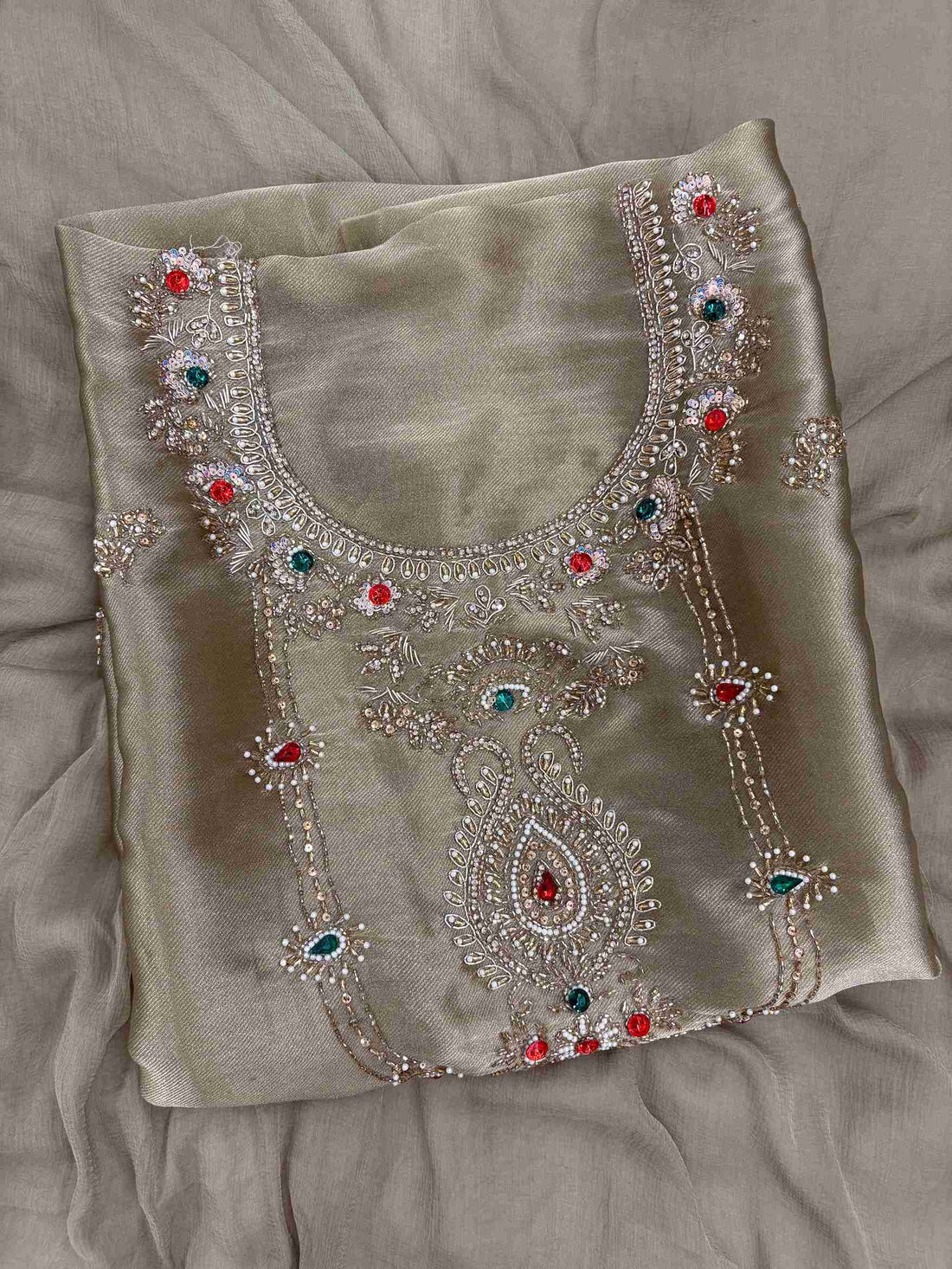 Zardozi motif detailing across olive green simmar tissue suit body