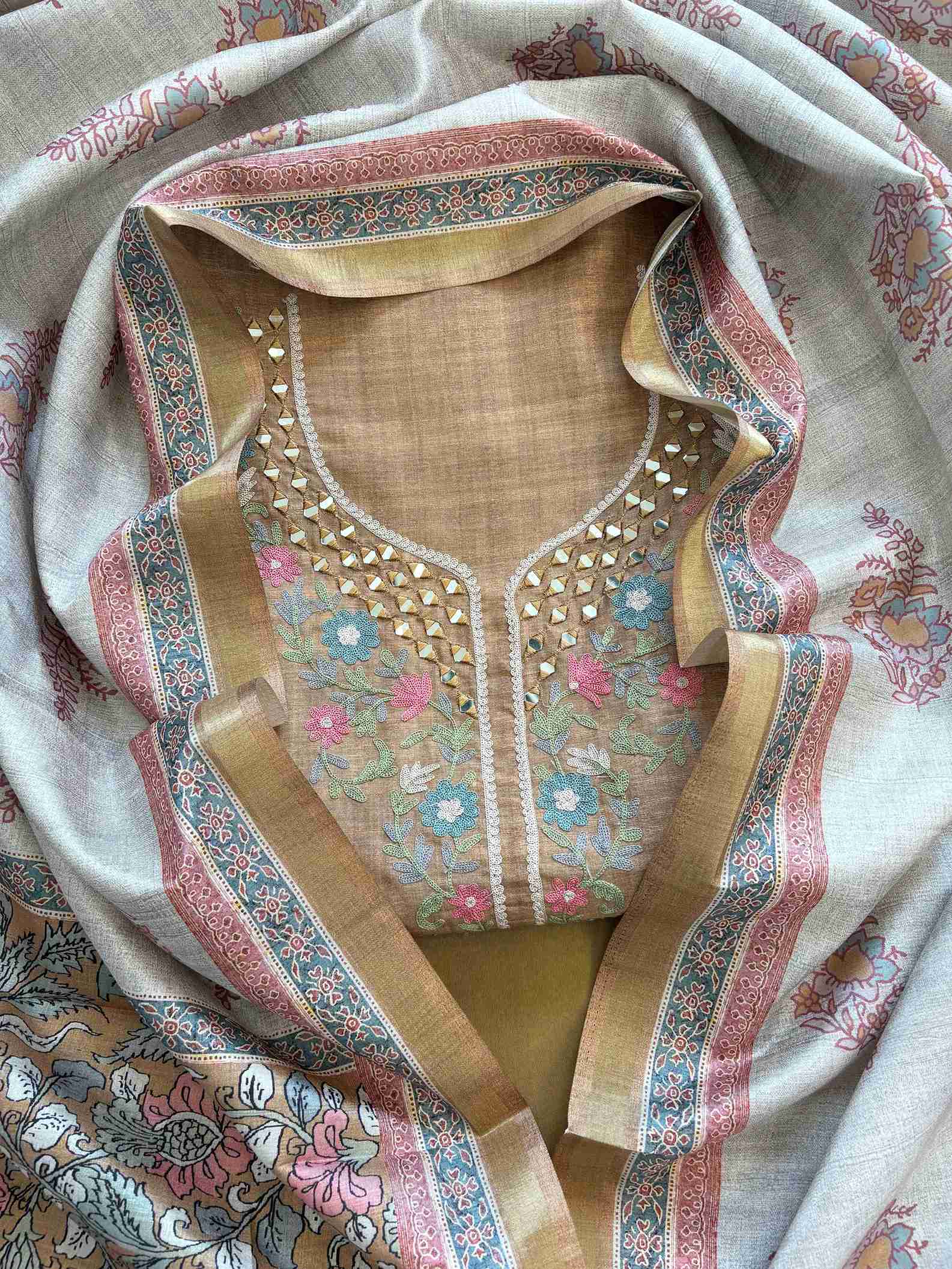 Olive green tusser silk unstitched suit with mirror and aari work neckline