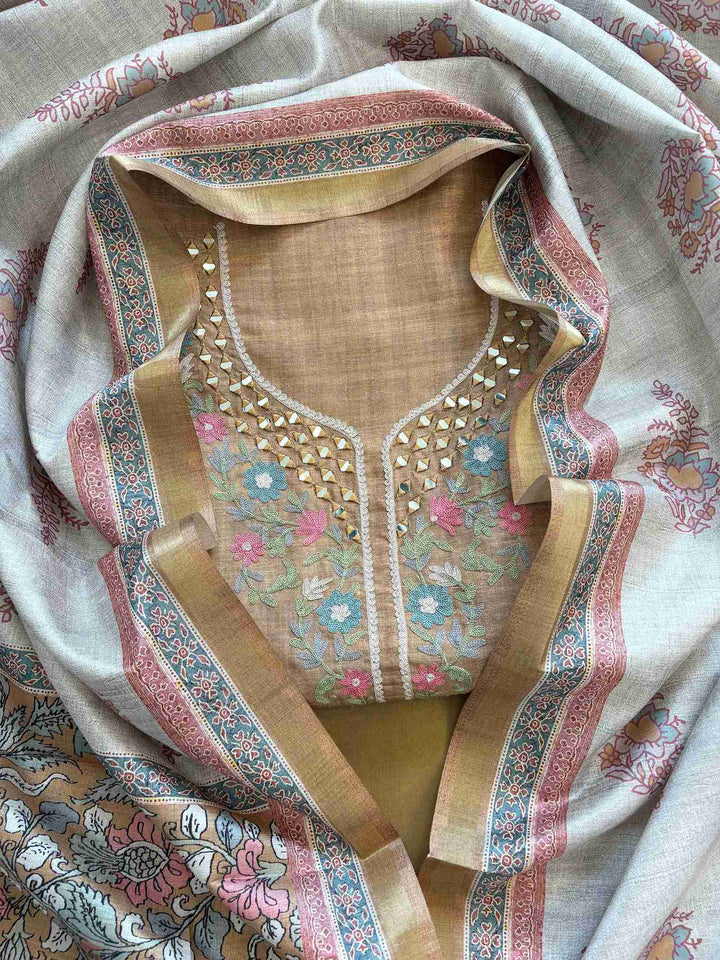 Olive green tusser silk unstitched suit with mirror and aari work neckline