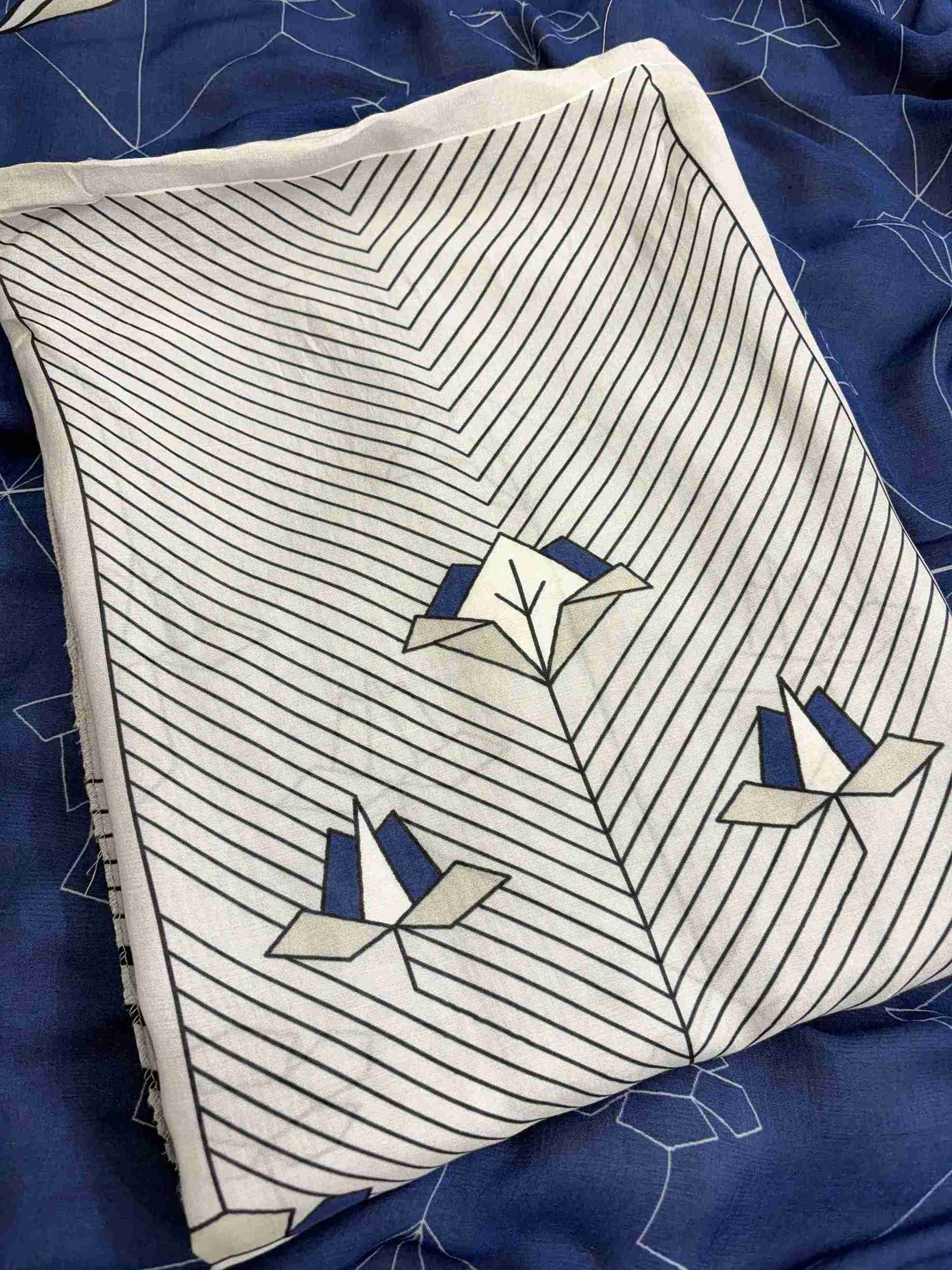 Close up of organza scalloped resham embroidery border on neckline