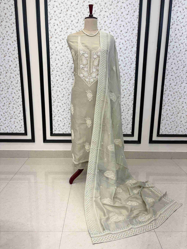 Pastel grey chikankari unstitched georgette suit set with chiffon dupatta on manequinn