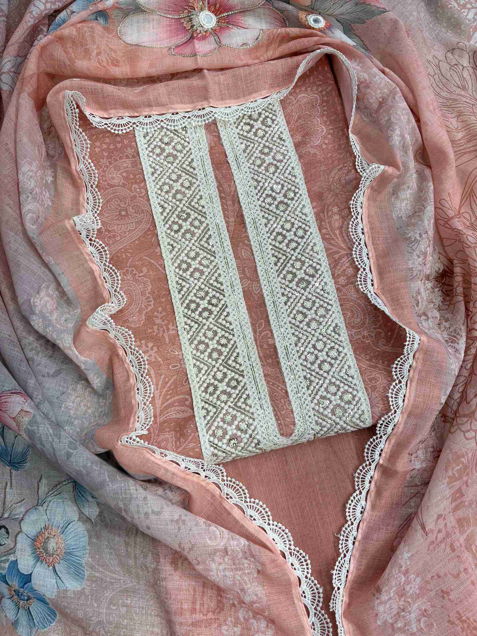 Broad crotia lace neckline panel with sequin highlighting on peach linen shirt