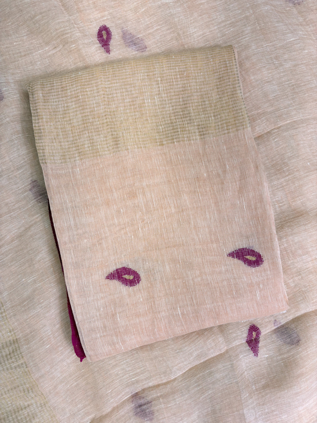 Thin golden stripe band at daaman hemline of peach linen unstitched shirt
