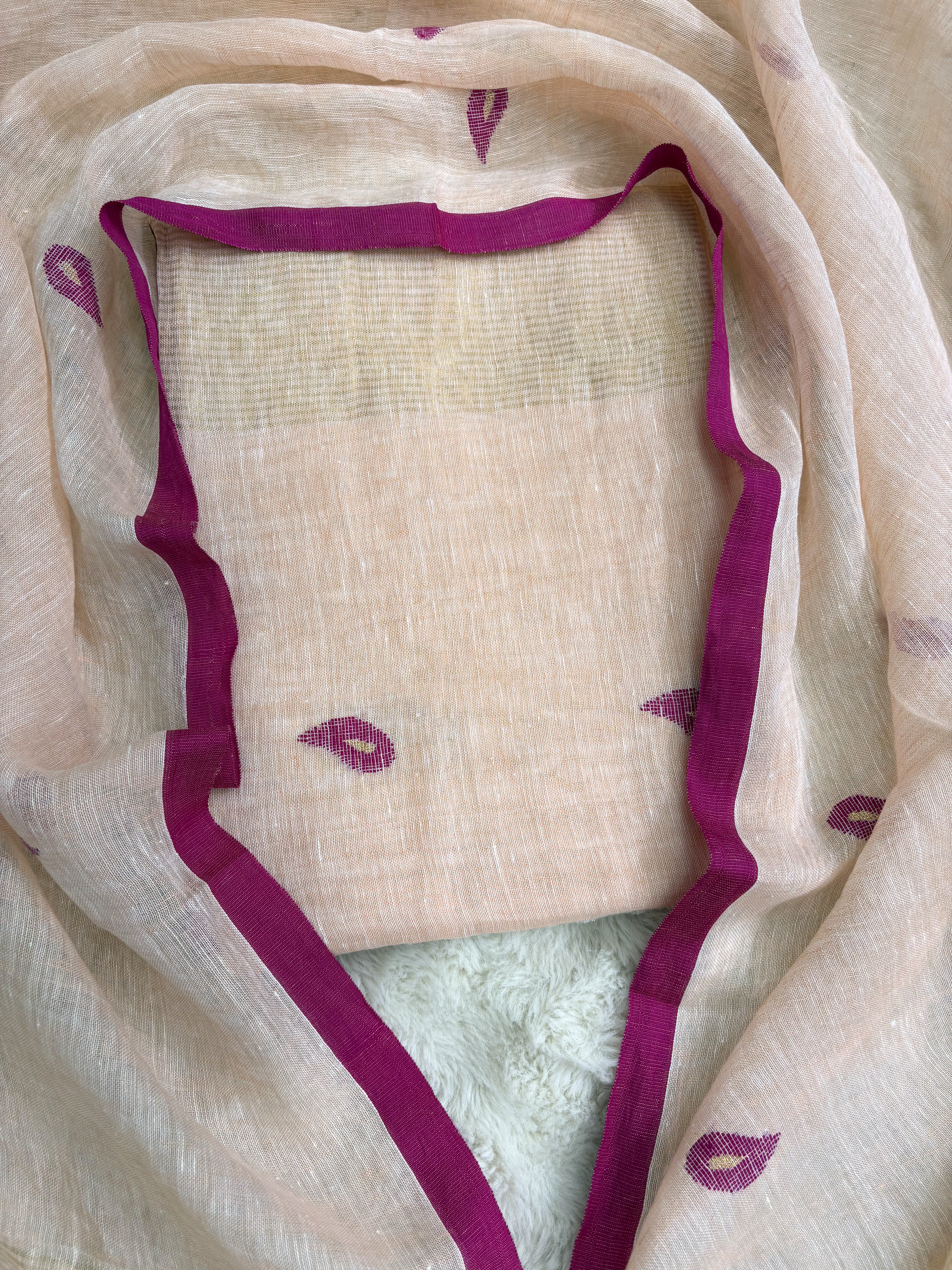 Complete peach linen unstitched 2-piece suit flat lay with shirt and dupatta showing pink paisley motifs and golden stripe