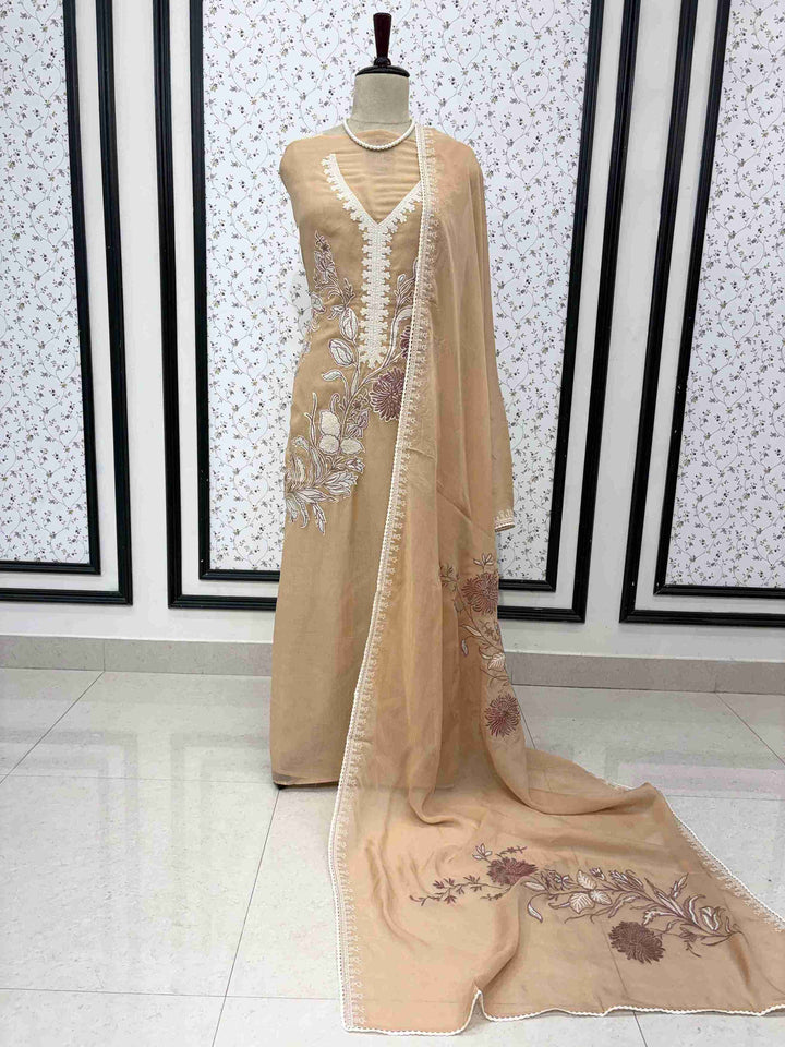 Peach mul cotton unstitched suit full front view with matching applique dupatta draped on mannequin