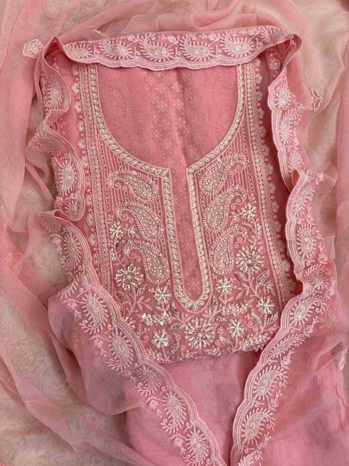 Close-up of chikankari neckline panel with moti, bead, and sequin embellishment on peach pink georgette shirt