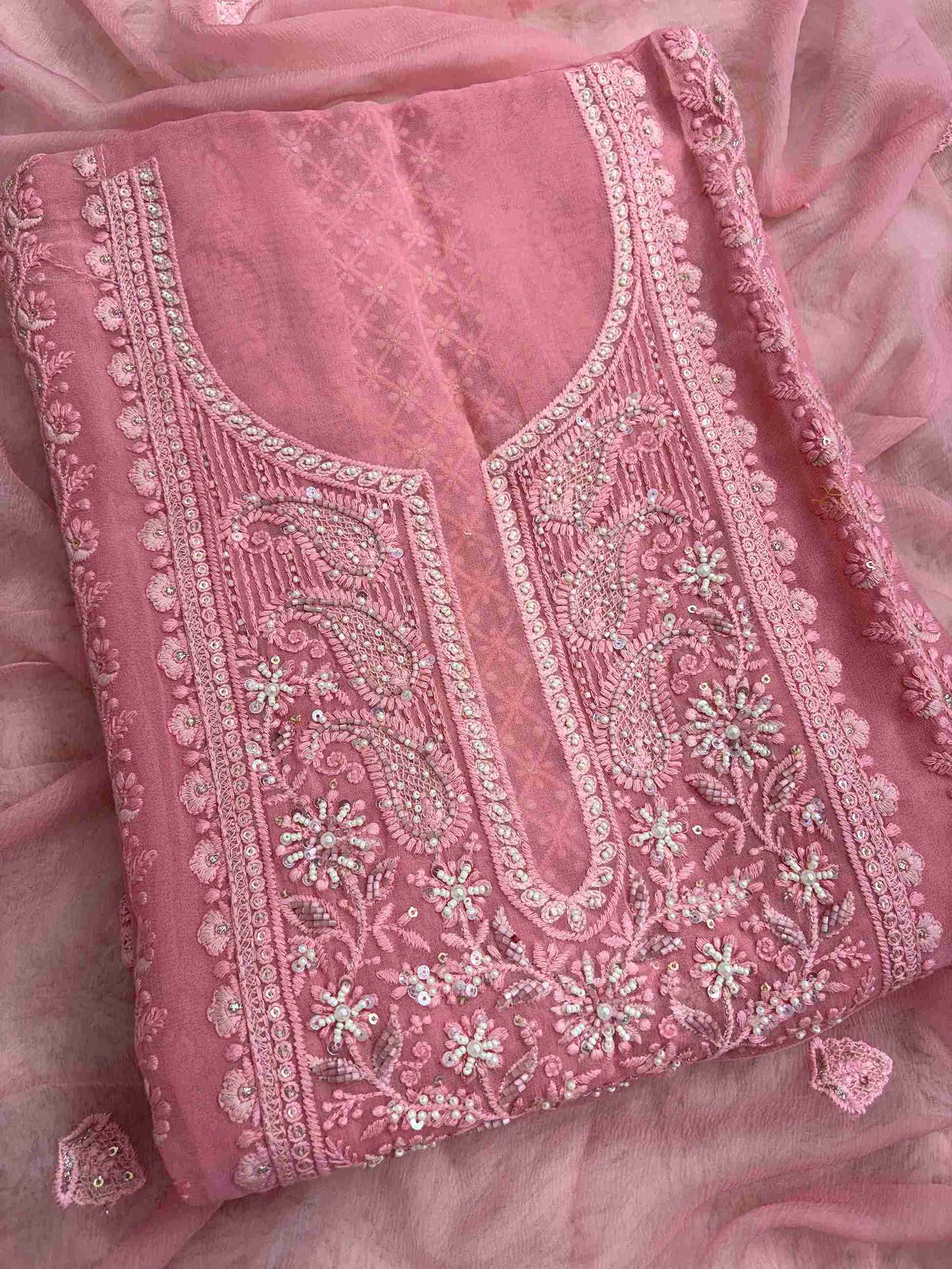 Geometric chikankari panel with paisley and floral motifs on peach pink georgette shirt front