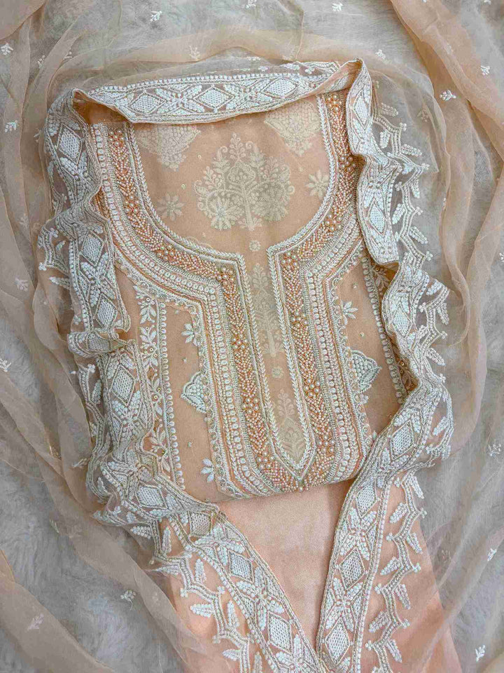 Peach heavy chikankari wedding wear unstitched suit set front view