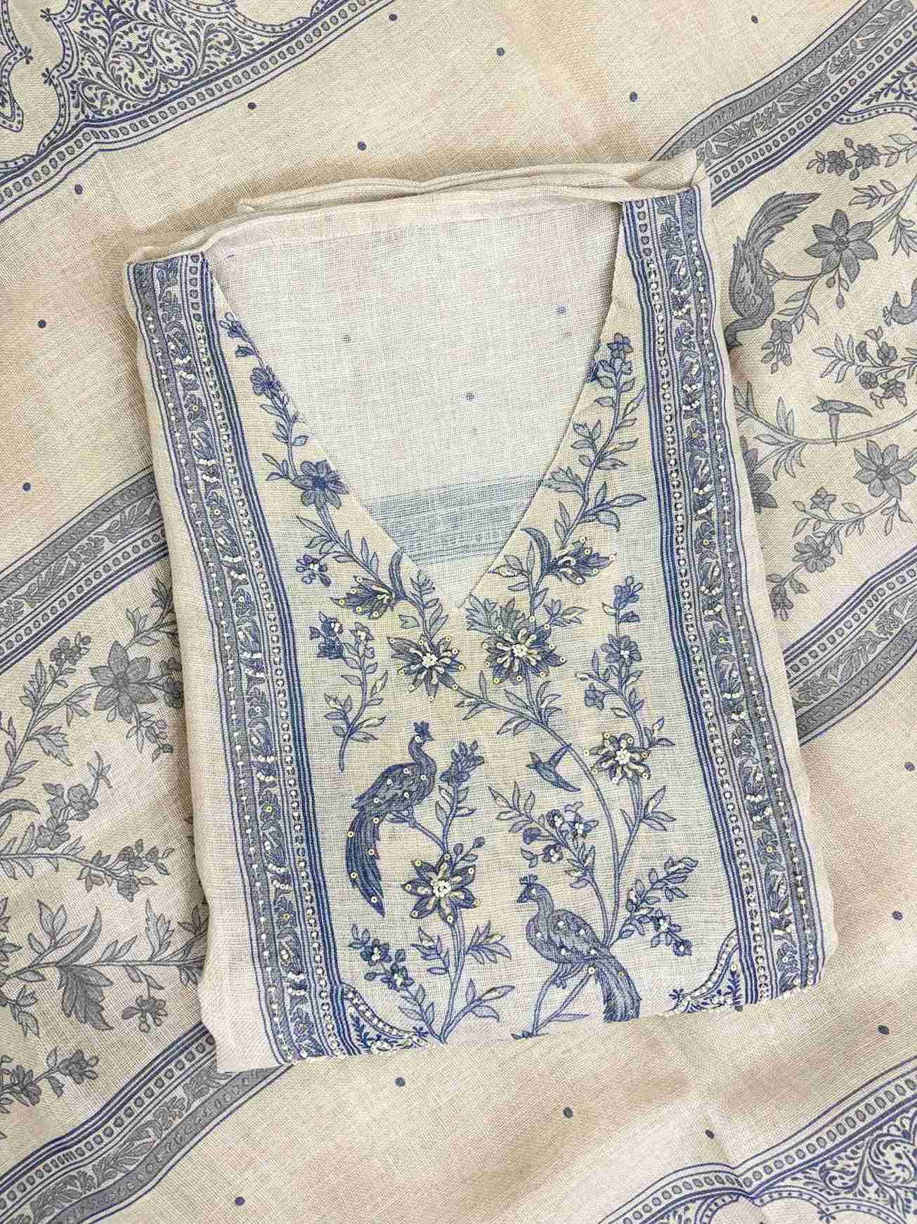 Broad printed geometric and paisley stripe pattern along longer sides of pearl grey linen dupatta