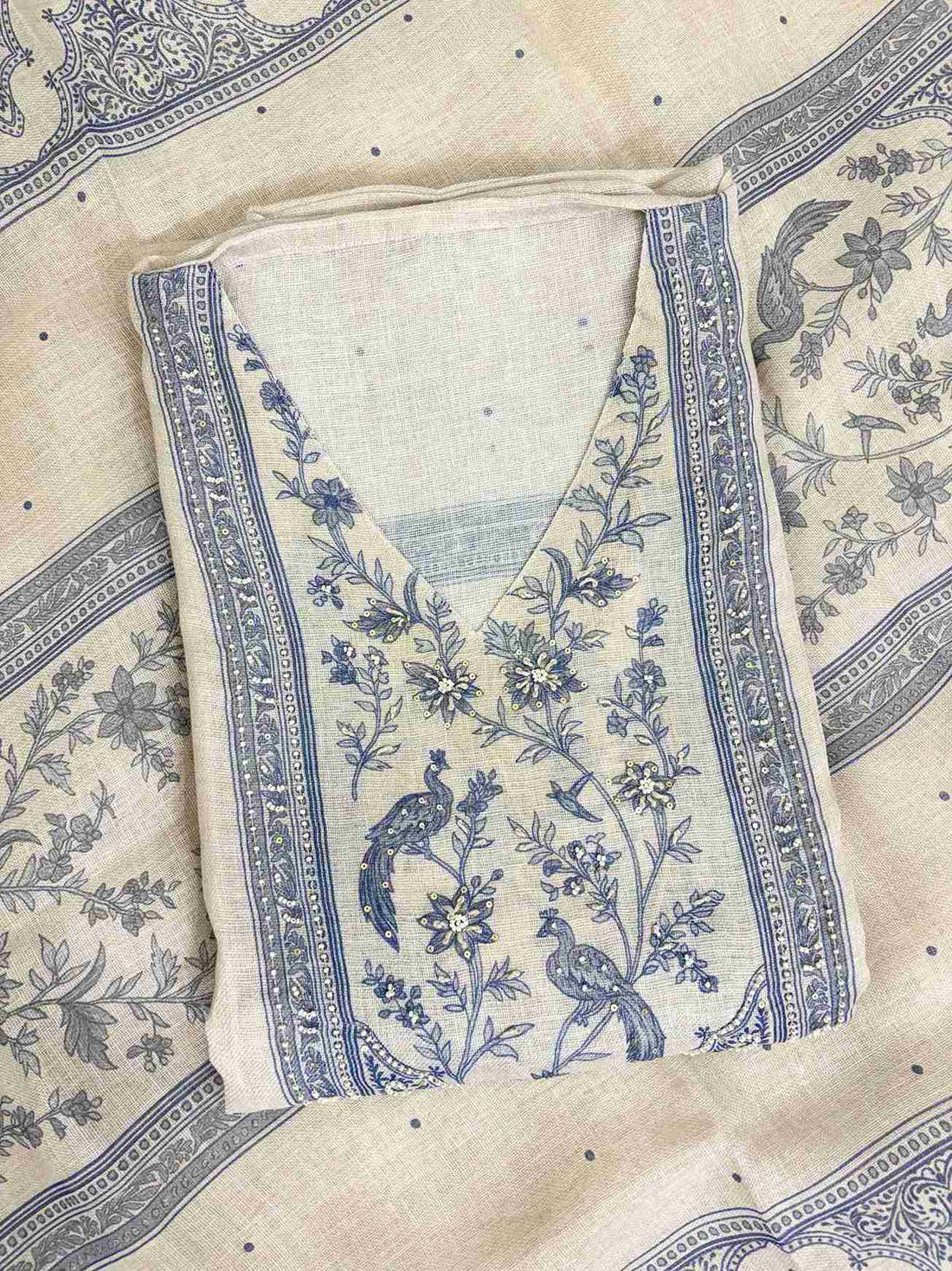 Broad printed geometric and paisley stripe pattern along longer sides of pearl grey linen dupatta