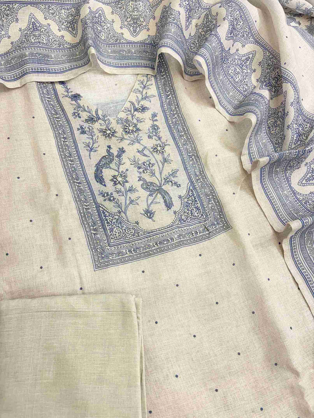 Pearl grey linen unstitched suit full front view worn by model with broad stripe pattern dupatta draped