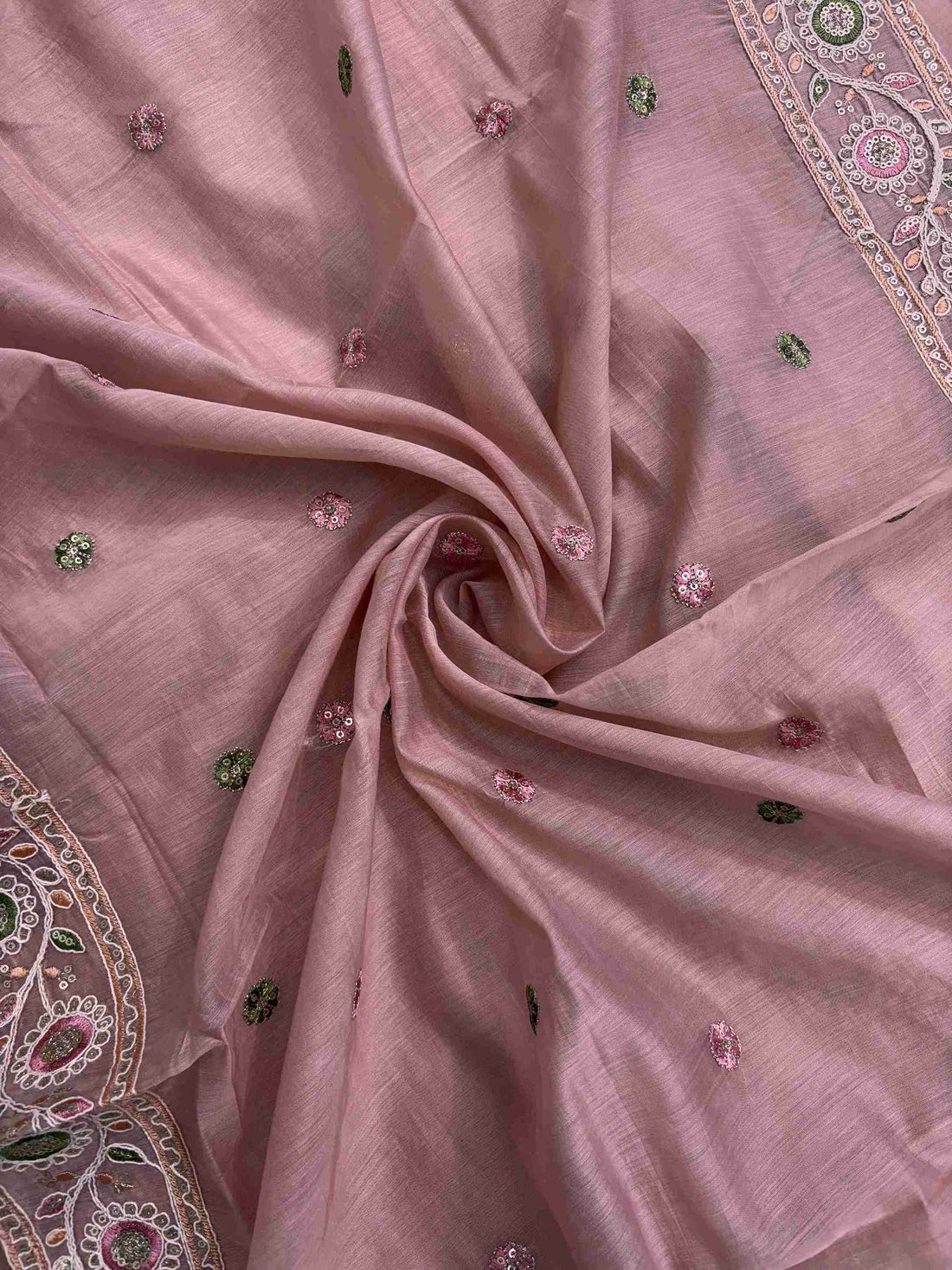 Scattered multicolor thread embroidered floral booties with mirror accents across pink mul chanderi dupatta