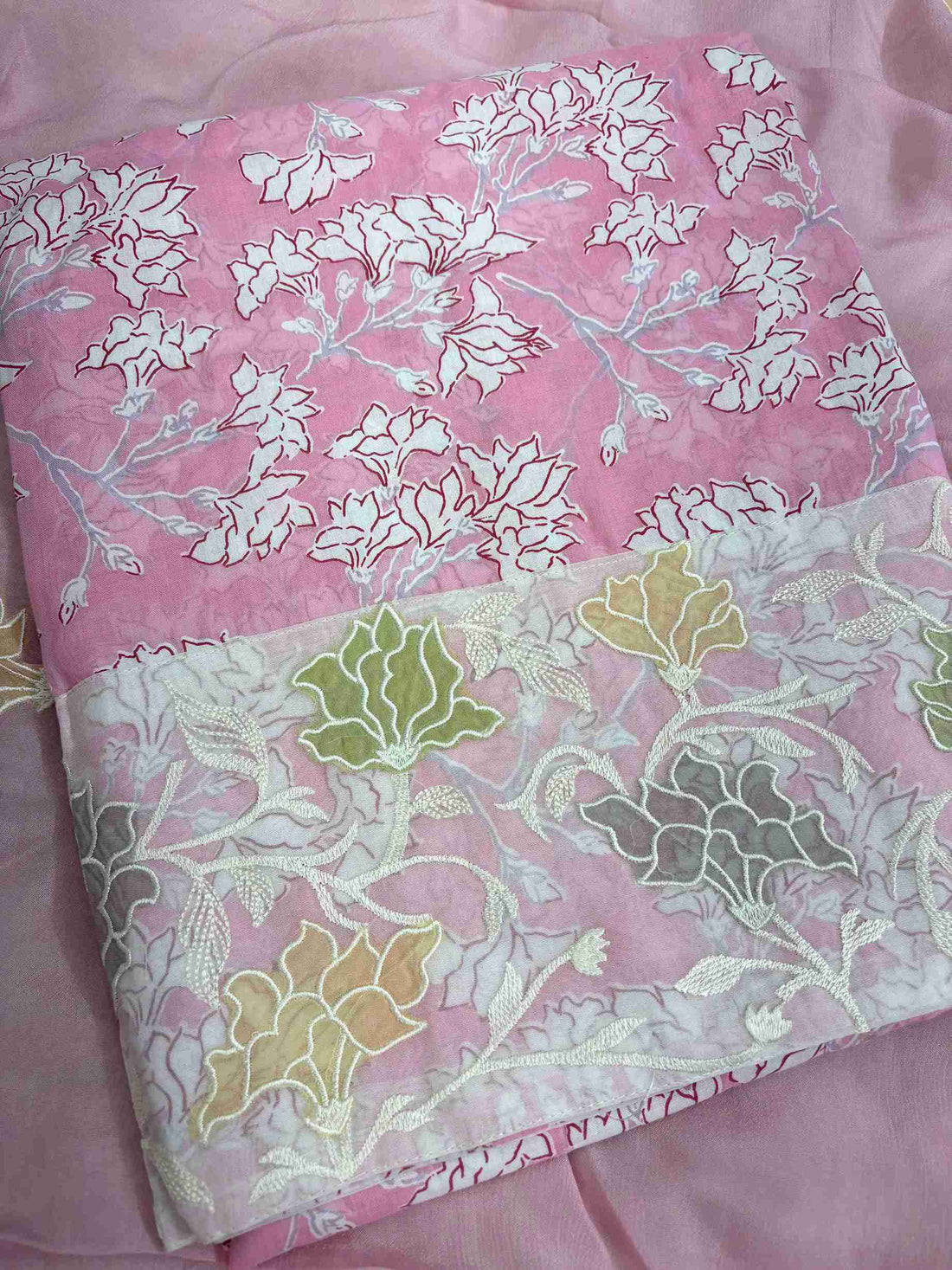 Lace highlighting detail at daaman hemline of pink floral printed cotton shirt