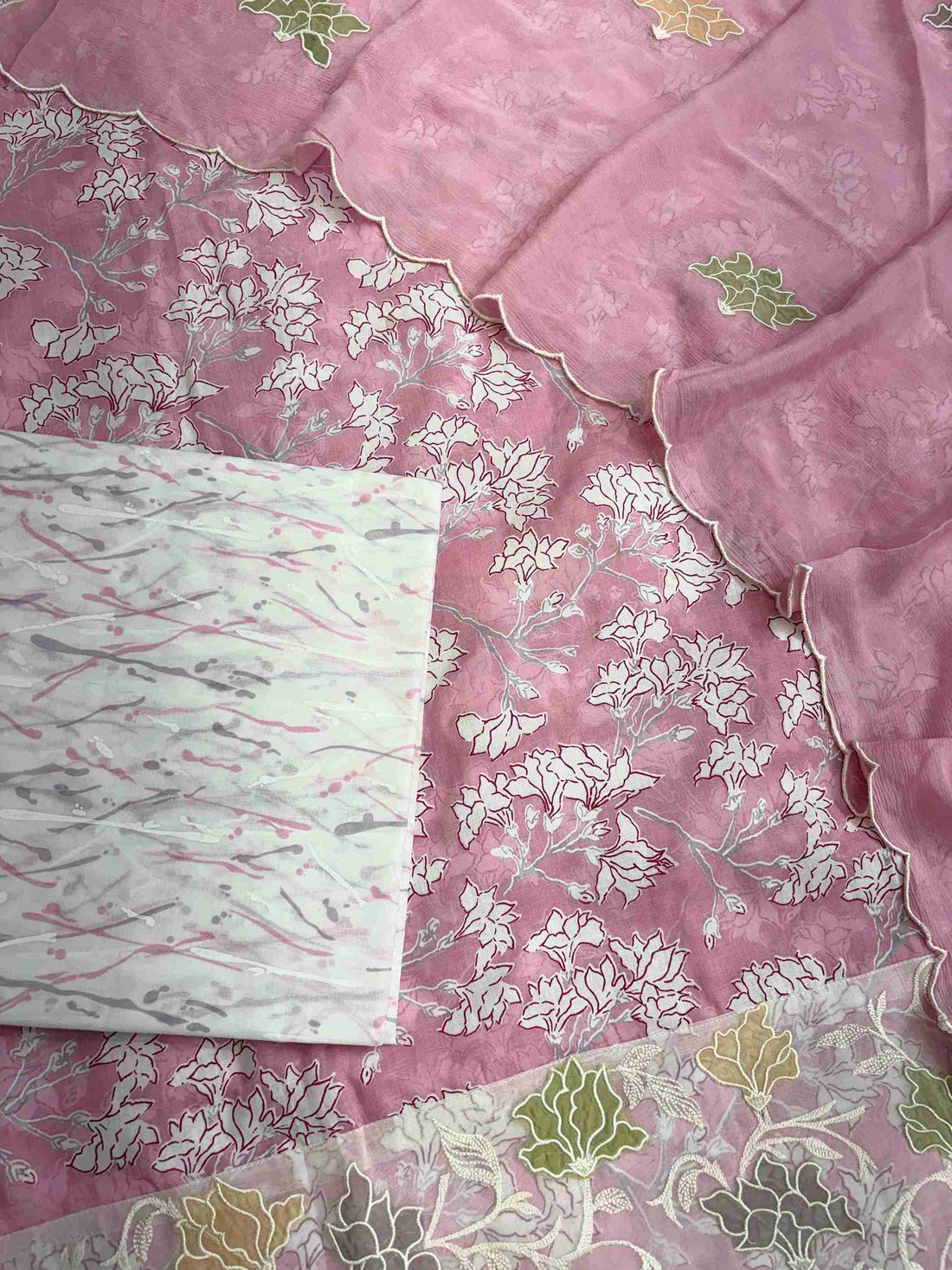 Complete pink cotton unstitched suit flat lay set with floral printed shirt, chinnon dupatta, and cotton bottom