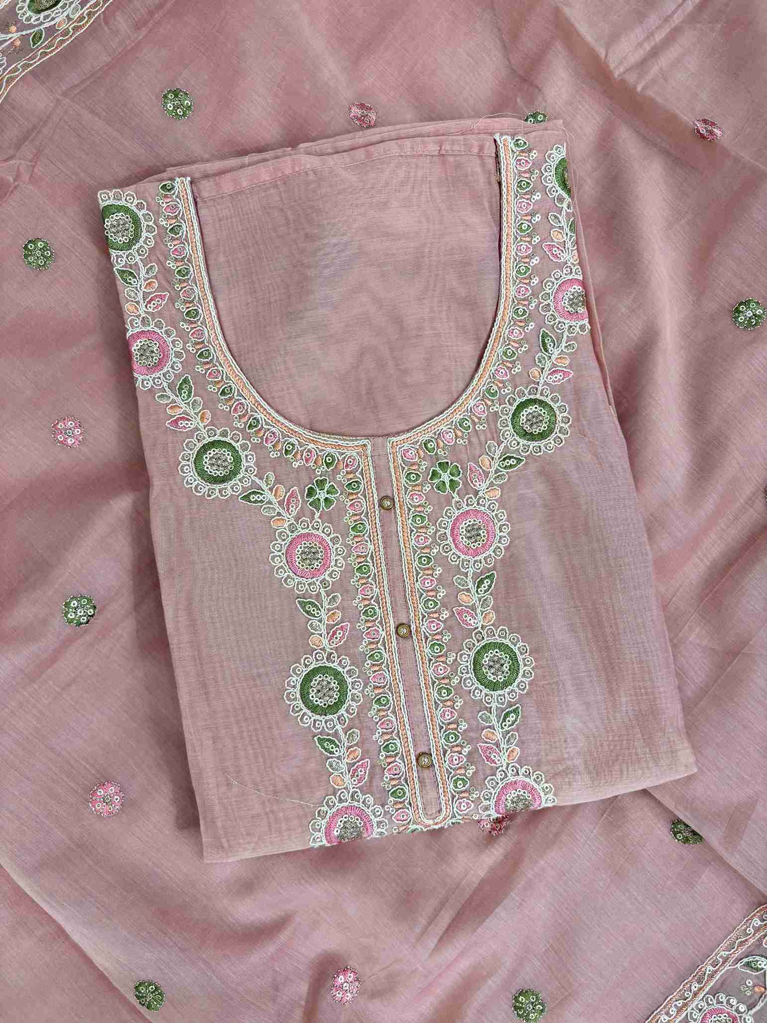 Multicolor thread embroidered floral motifs with mirror work at neckline and front placket of lemon yellow mul chanderi shirt