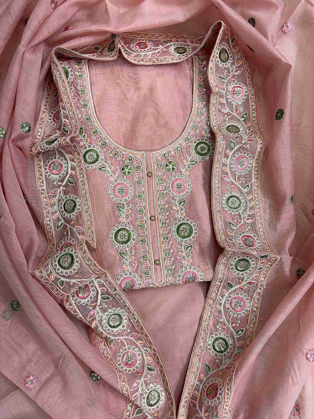 Scalloped crotia lace border finishing at hemline of pink mul chanderi unstitched shirt