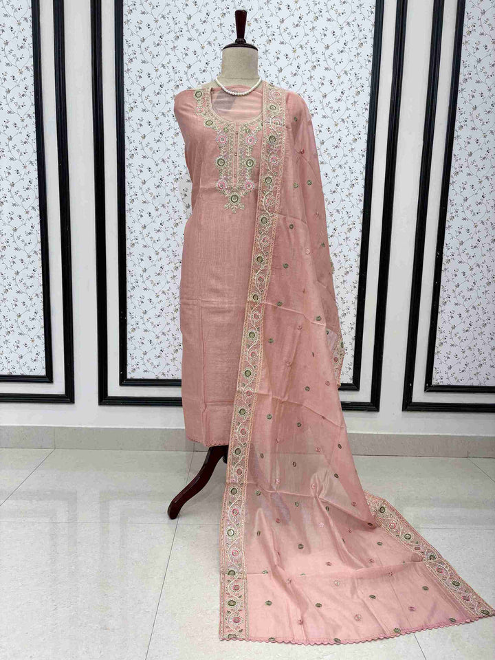 pink mul chanderi unstitched suit full front view with embroidered booty dupatta draped on mannequin
