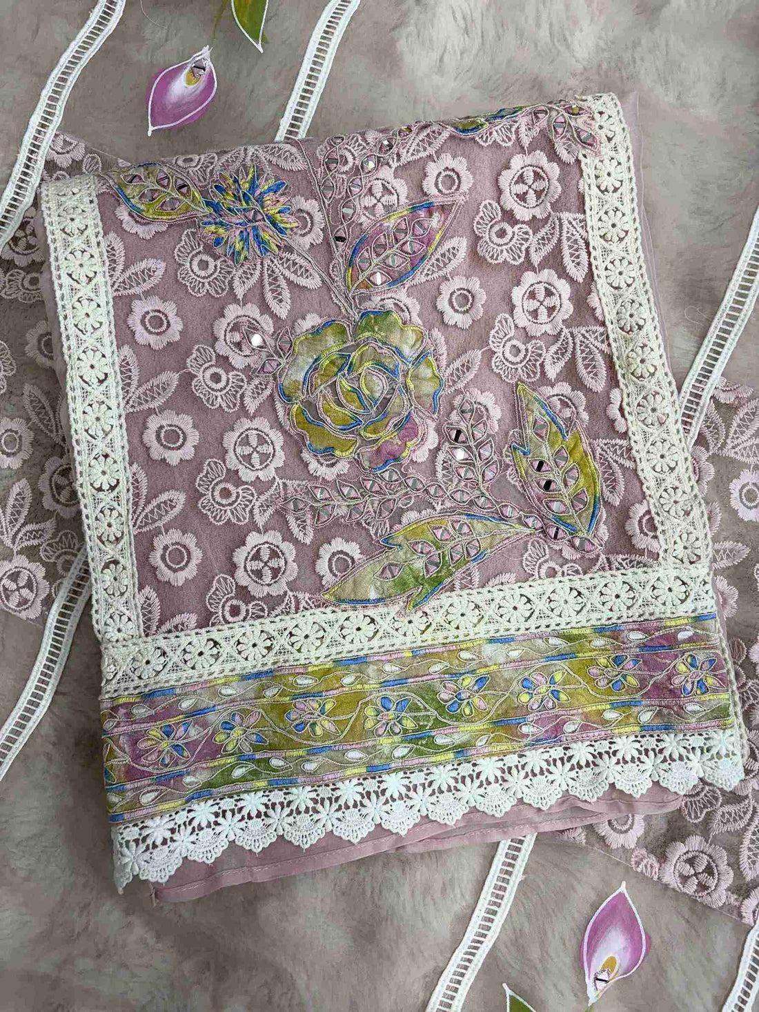 White lace panels and hand-painted pink and lilac floral designs on pista green organza dupatta