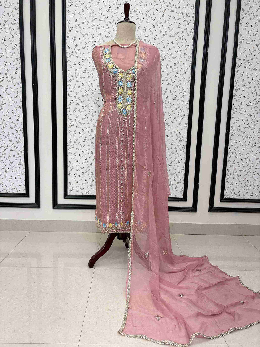 Pink shimmer tissue unstitched suit full front view with gota lace bordered chiffon dupatta draped on mannequin