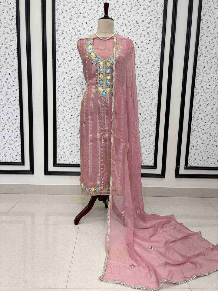 Pink shimmer tissue unstitched suit full front view with gota lace bordered chiffon dupatta draped on mannequin