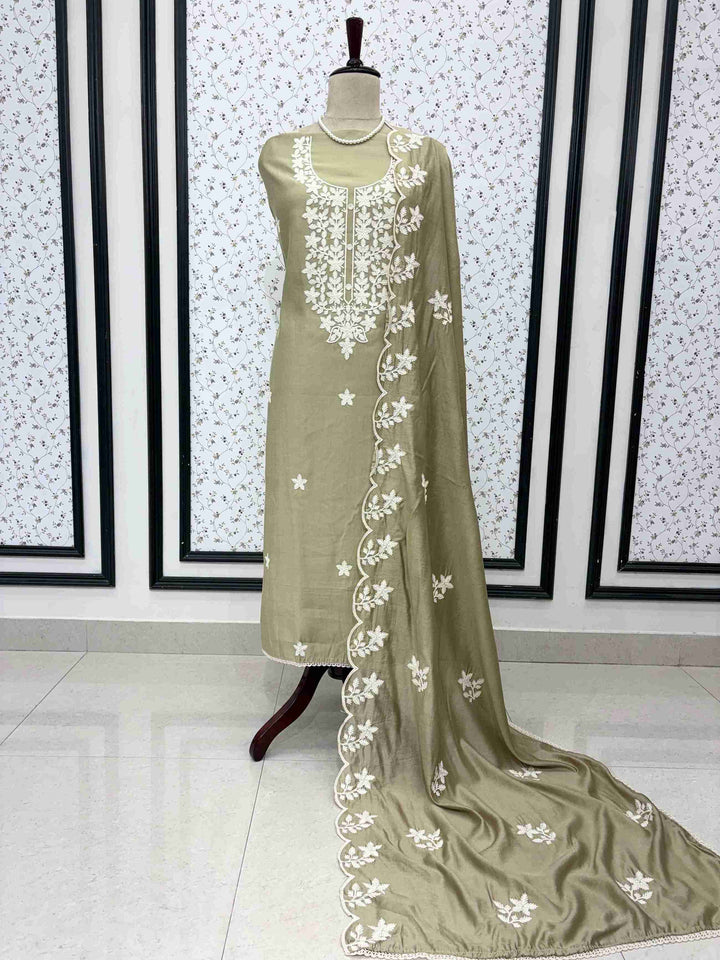 Pista green jaam cotton unstitched suit full front view with crotia embroidered dupatta draped on mannequin