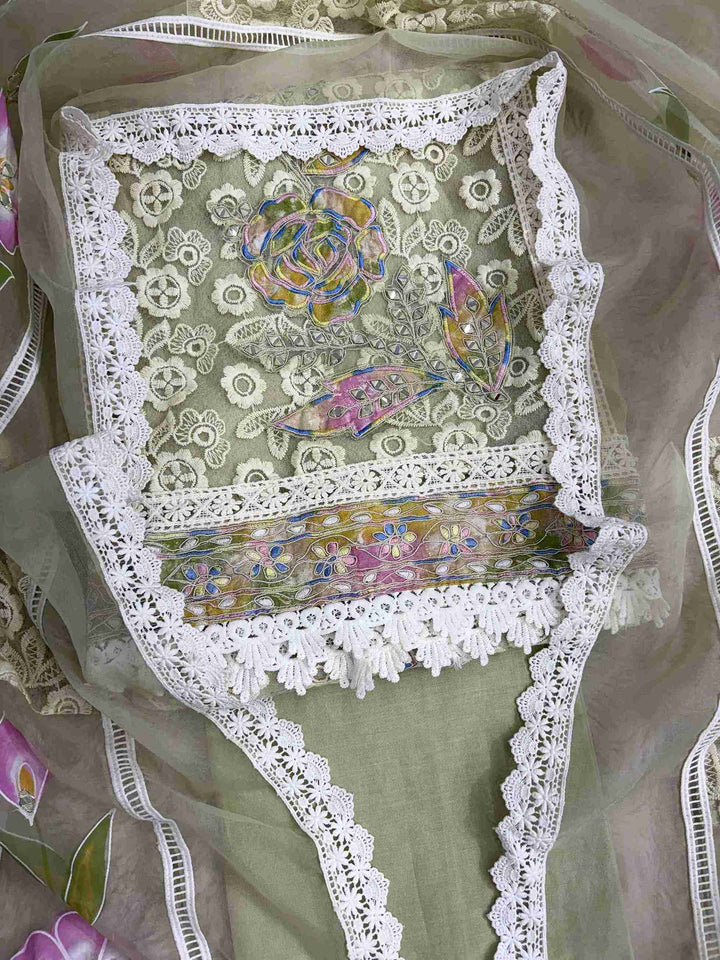 White lace panels and hand-painted pink and lilac floral designs on pista green organza dupatta