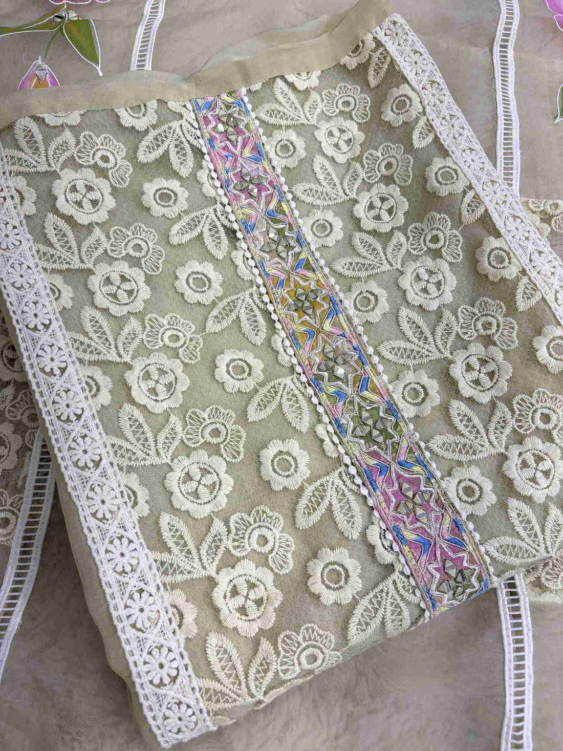Georgette organza panel with multicolor floral thread embroidery and mirror work highlighting on pista green shirt