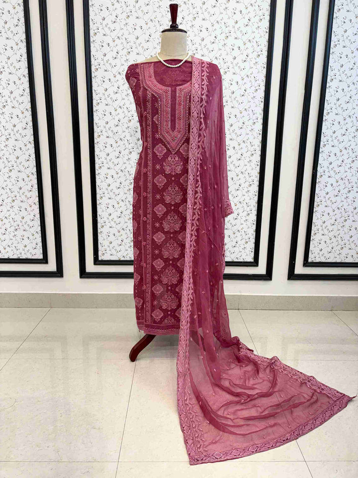 Styled drape of plum chikankari georgette suit with chiffon dupatta on manequinn