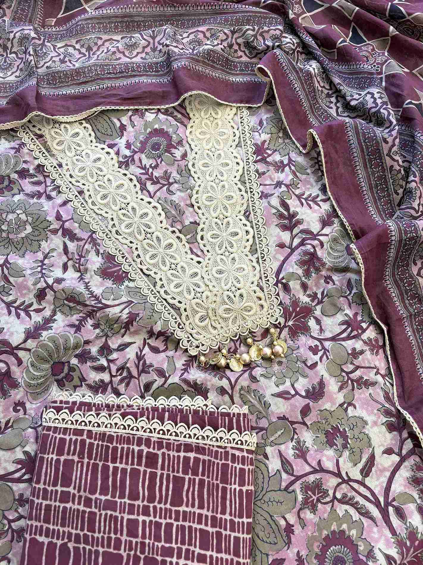 Complete plum cotton unstitched suit flat lay set with floral printed shirt, steel blue dupatta, and matching printed bottom