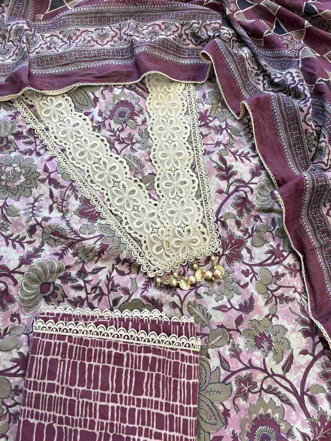 Complete plum cotton unstitched suit flat lay set with floral printed shirt, steel blue dupatta, and matching printed bottom