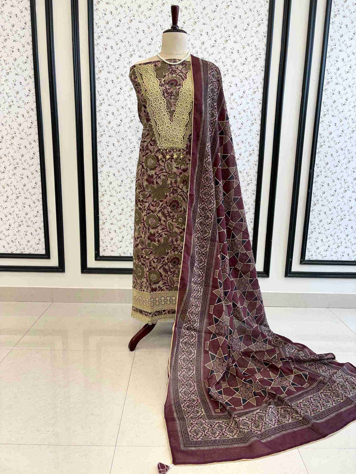 Plum cotton unstitched suit full front view with steel blue geometric star print dupatta draped on mannequin