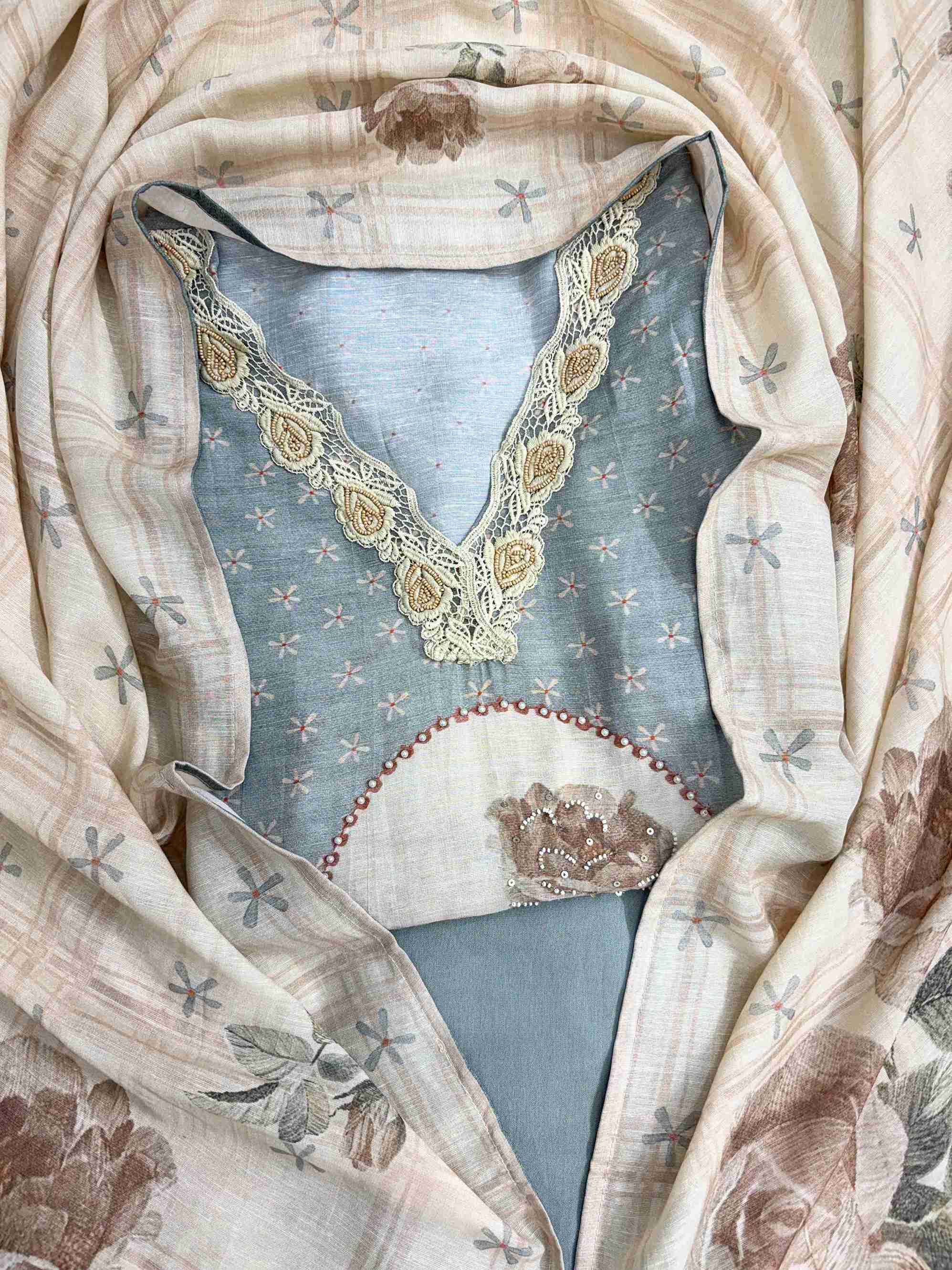 Complete powder grey linen cotton unstitched suit flat lay set with shirt, narrow dupatta, and cotton silk bottom