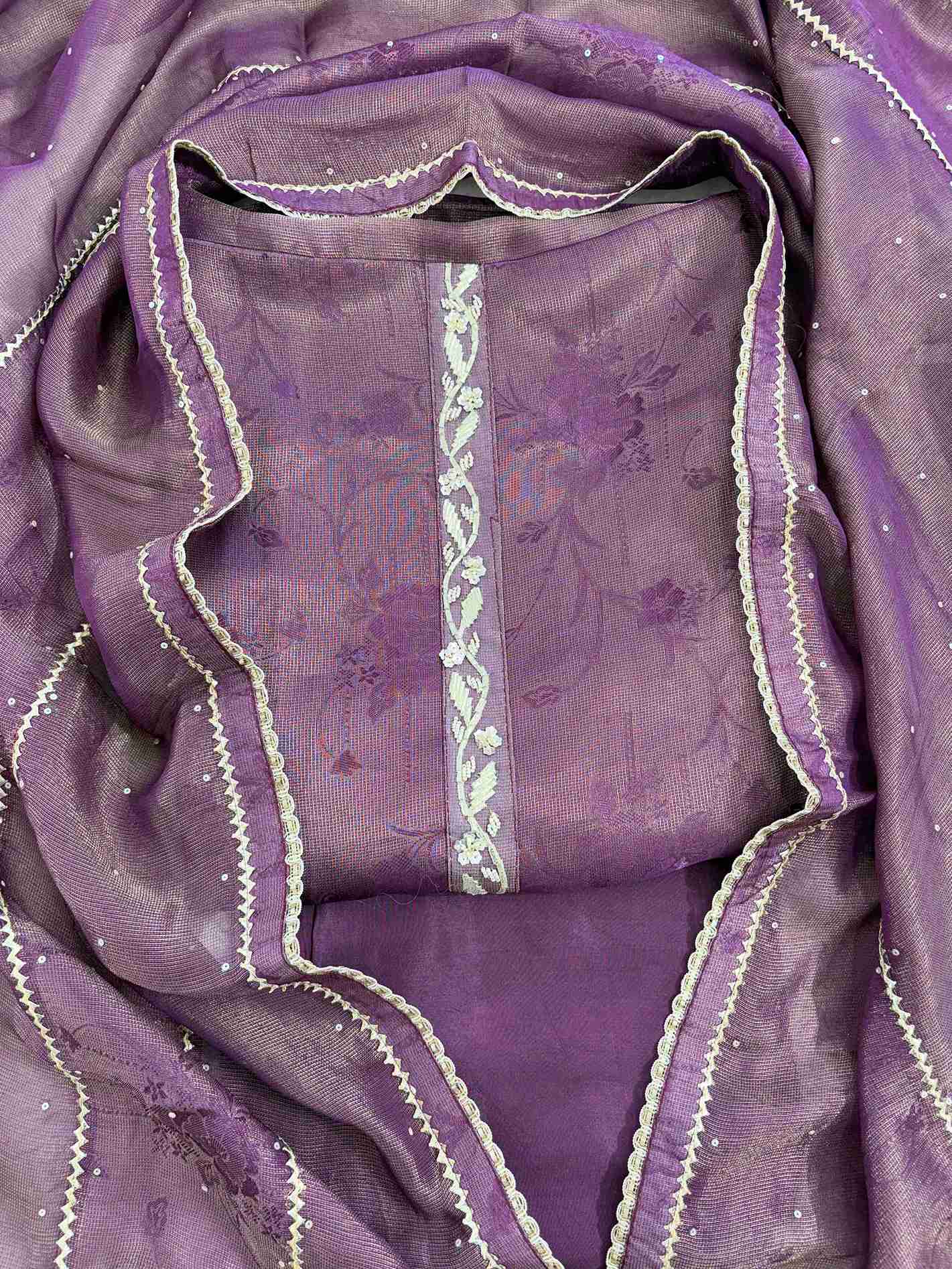 Close-up of gota neckline on purple Burberry tissue suit