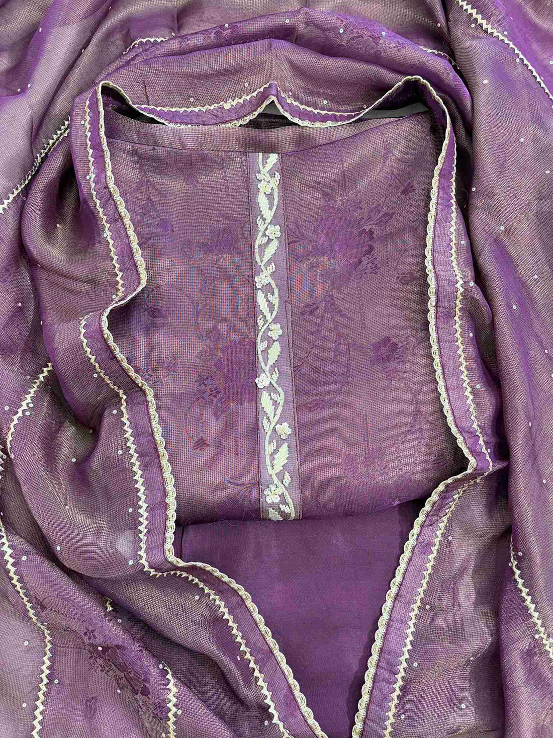 Close-up of gota neckline on purple Burberry tissue suit